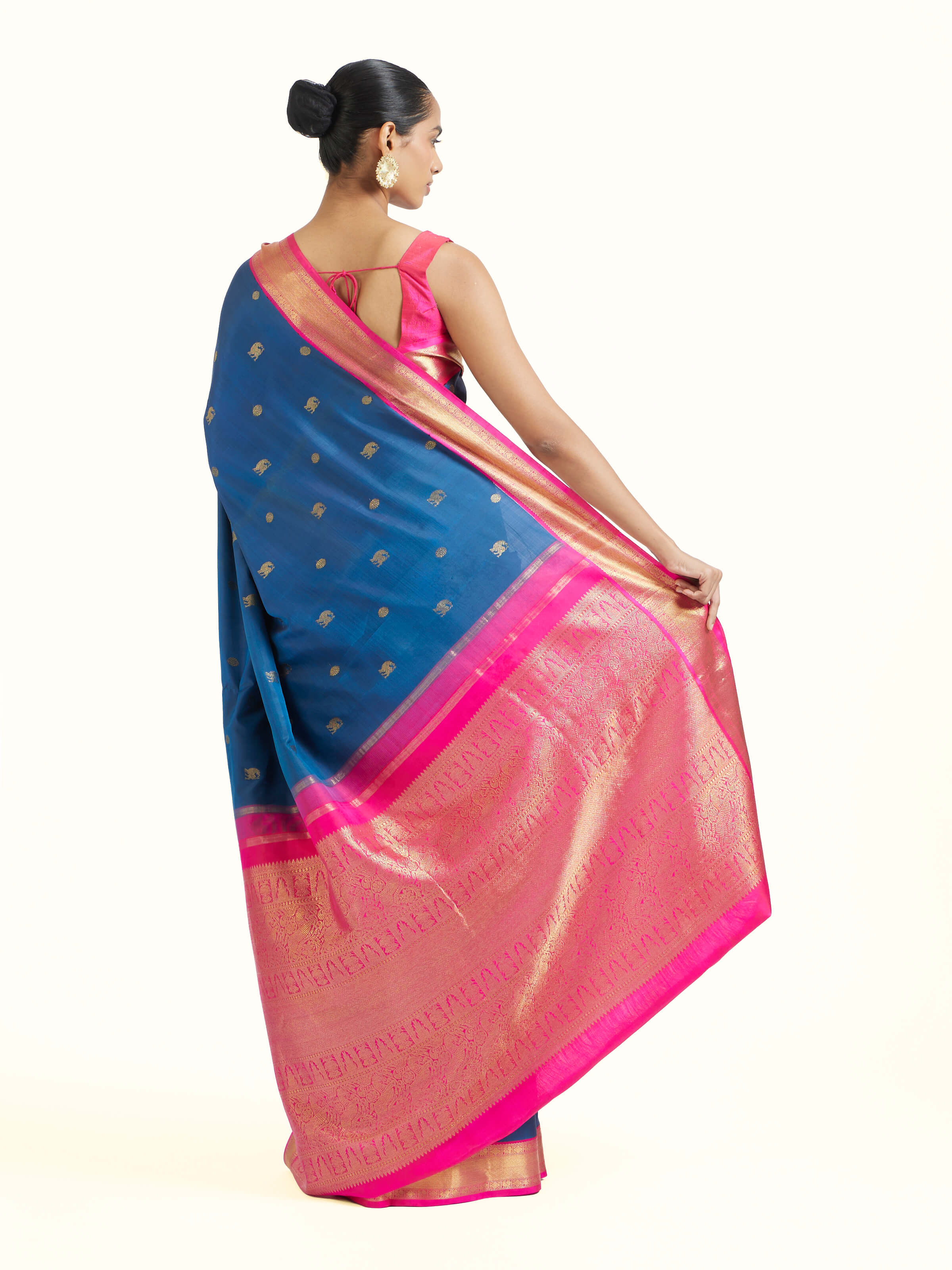 Back view of dark blue silk Kancheepuram saree displaying ornate pallu design