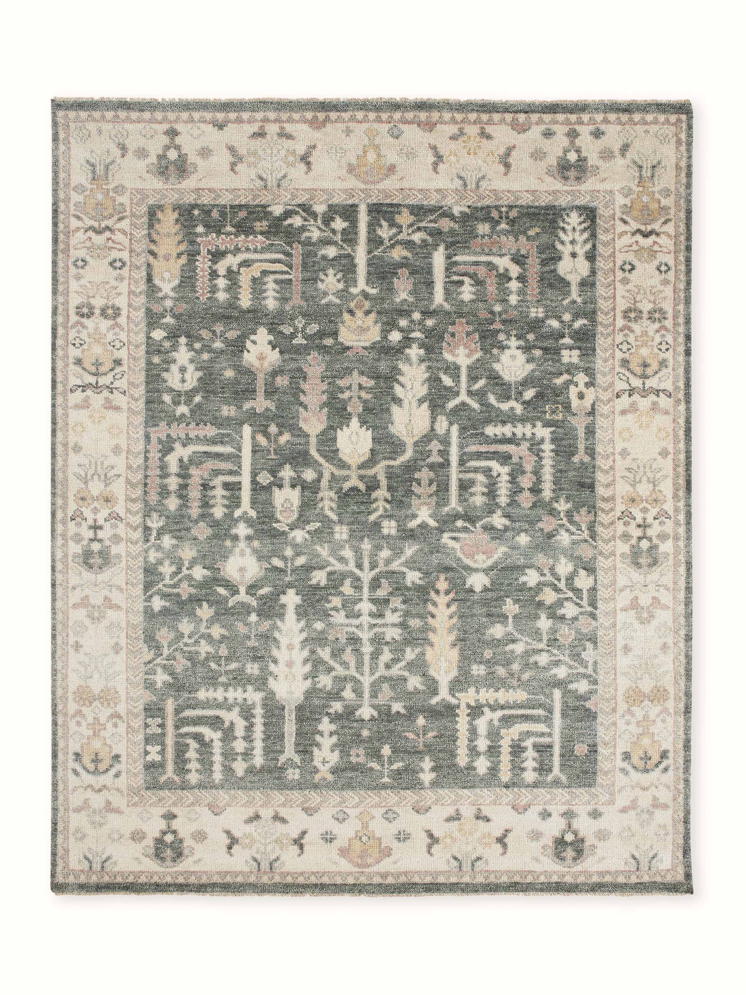 Front view: Front view of hand-knotted green Bhadohi Oushak wool rug with intricate floral patterns.