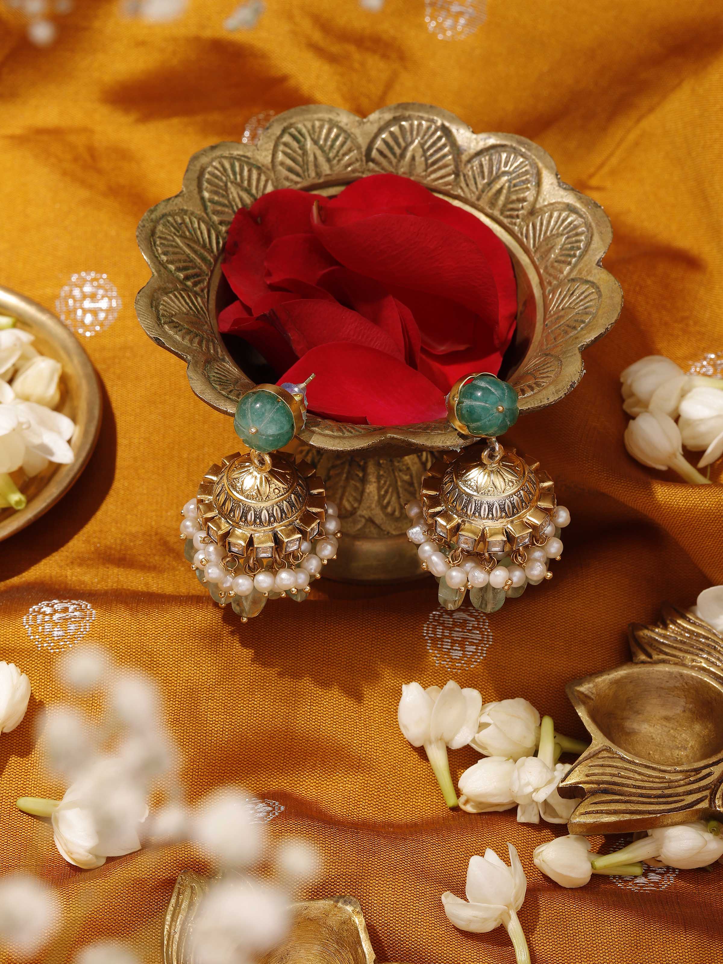 Lifestyle image of Silver Smithing jhumkas styled with ethnic ensemble, adding a touch of tradition.