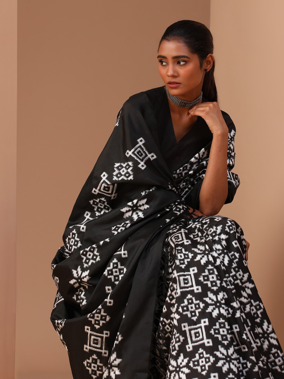 Close-up focusing on the sophisticated craftsmanship of the double ikat design.