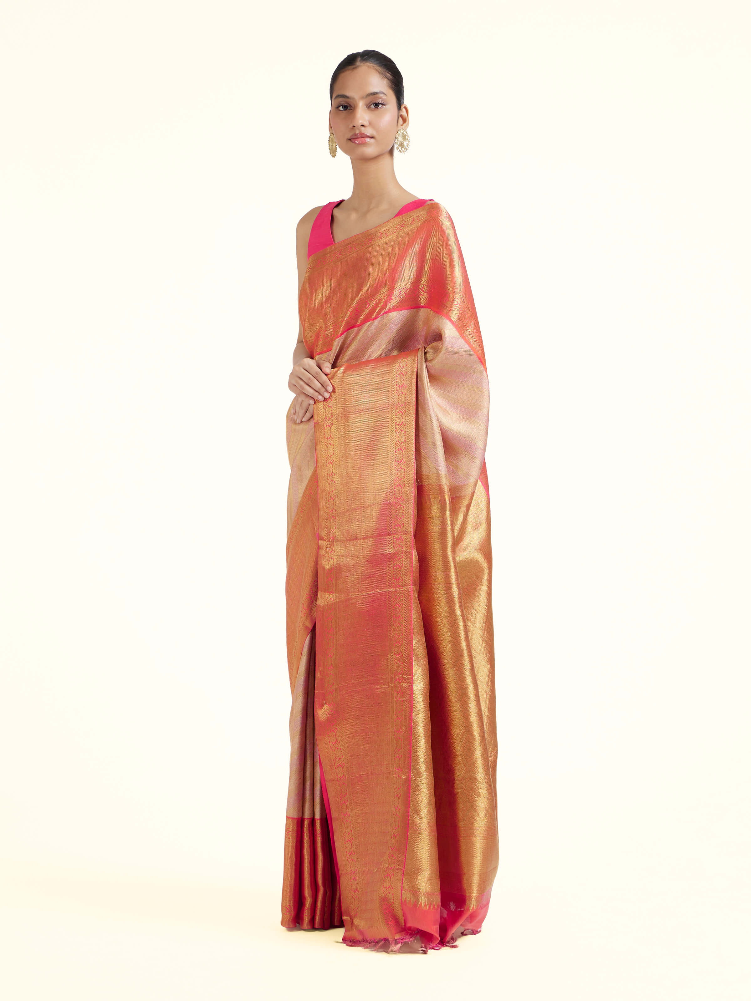 Side view of light pink silk Kancheepuram saree with graceful drape and contrast border