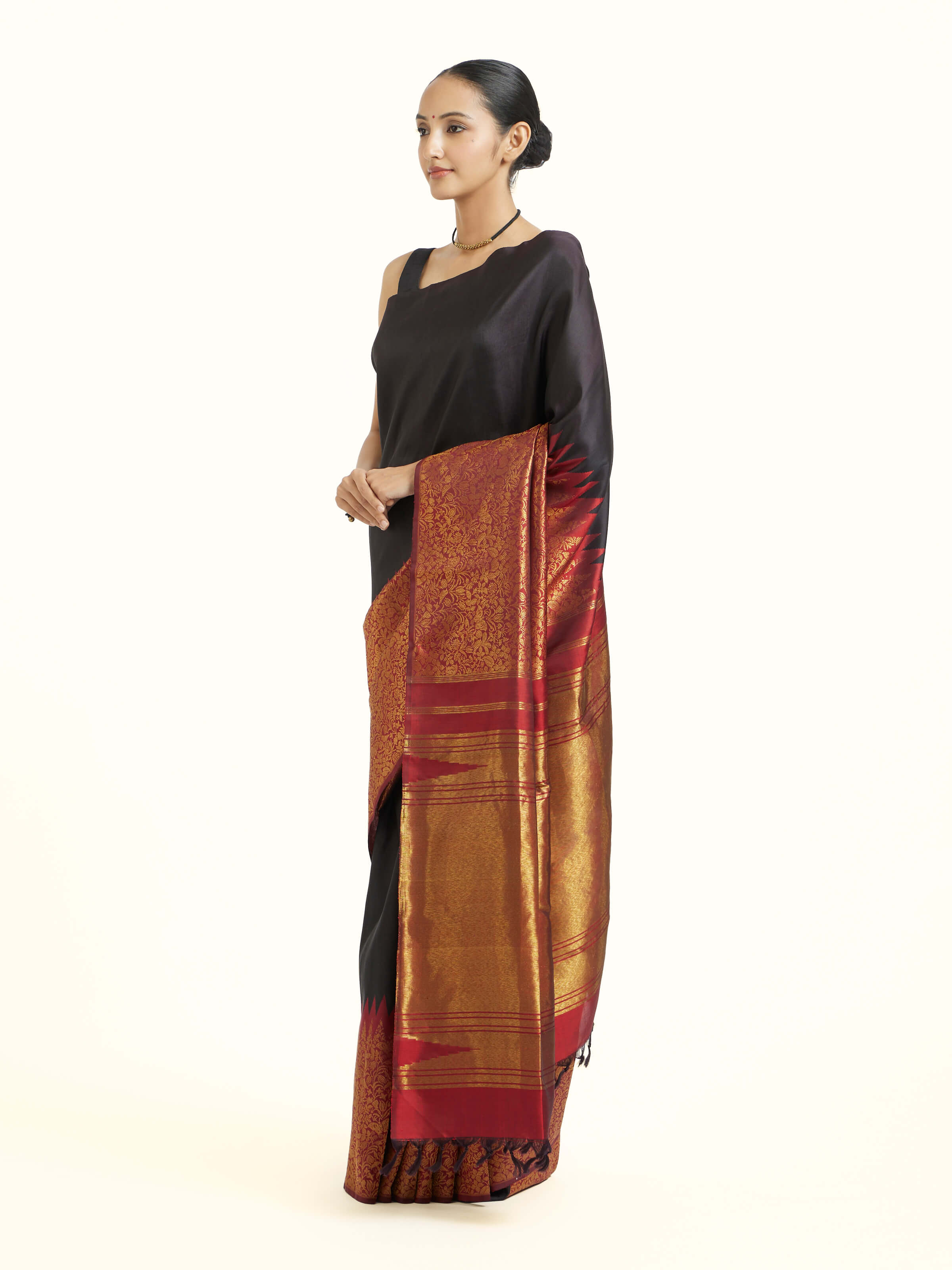 Side view of black silk Kancheepuram saree with elegant drape and broad border