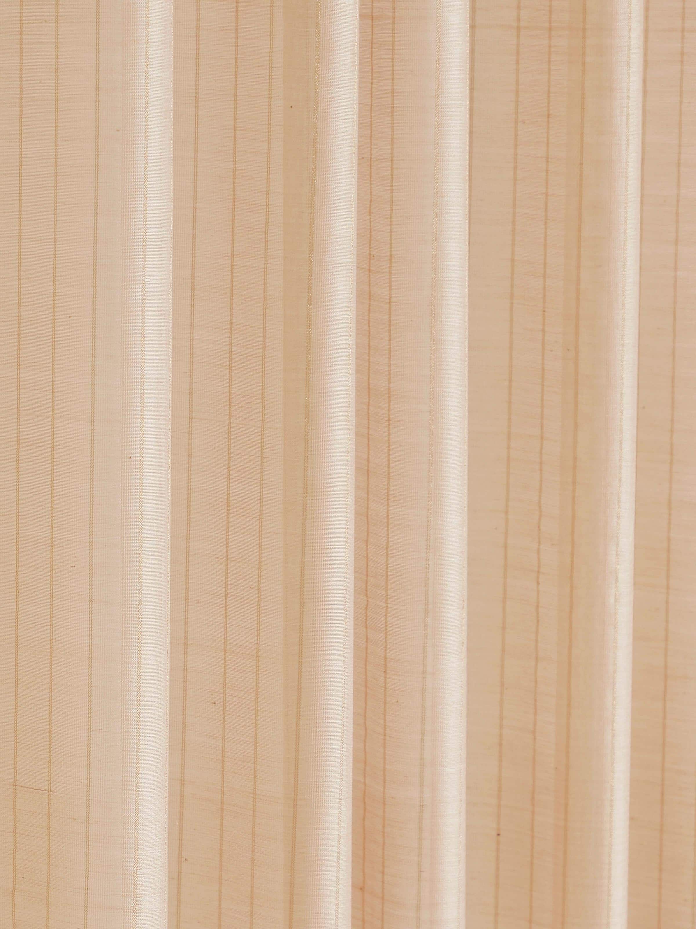 Detail shot showing metallic stripe accents on handwoven beige Maheshwari sheer curtain fabric.
