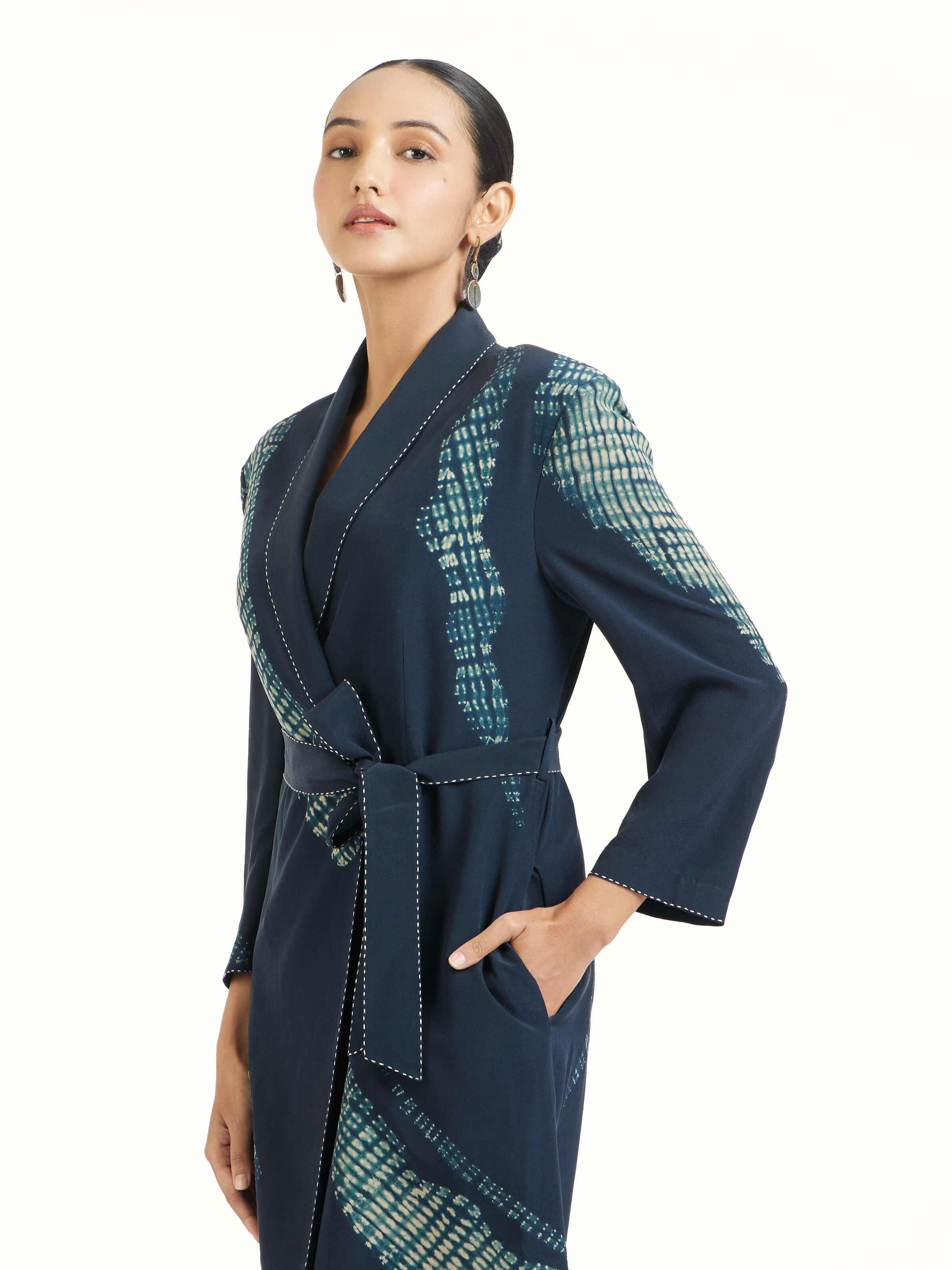 Angled view of blue shibori jacket dress highlighting shibori patterns