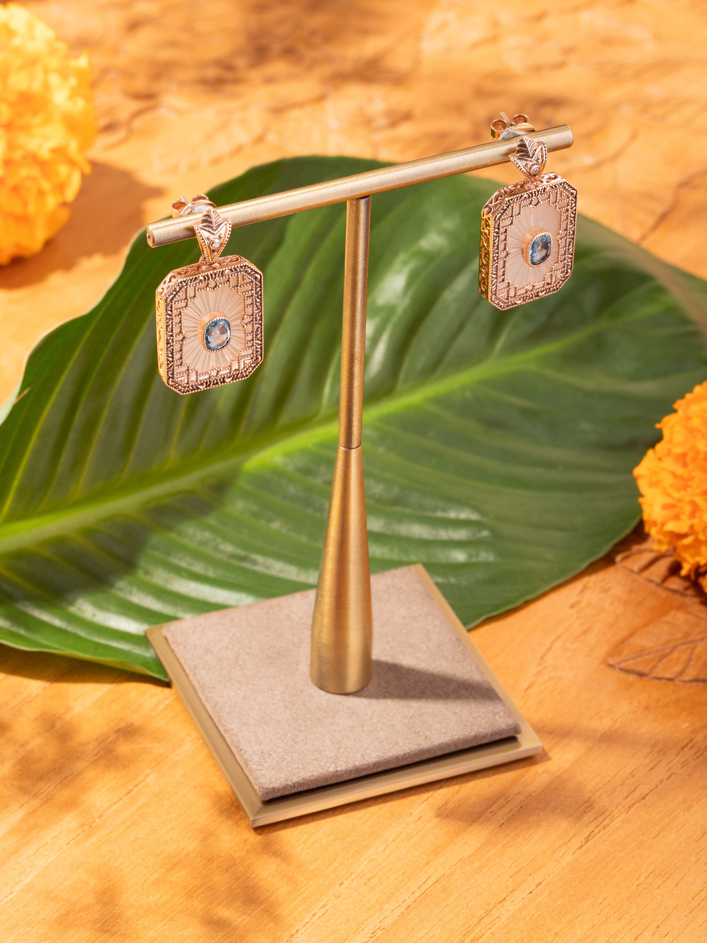 Lifestyle view of lapidary 14 karat gold drop earrings