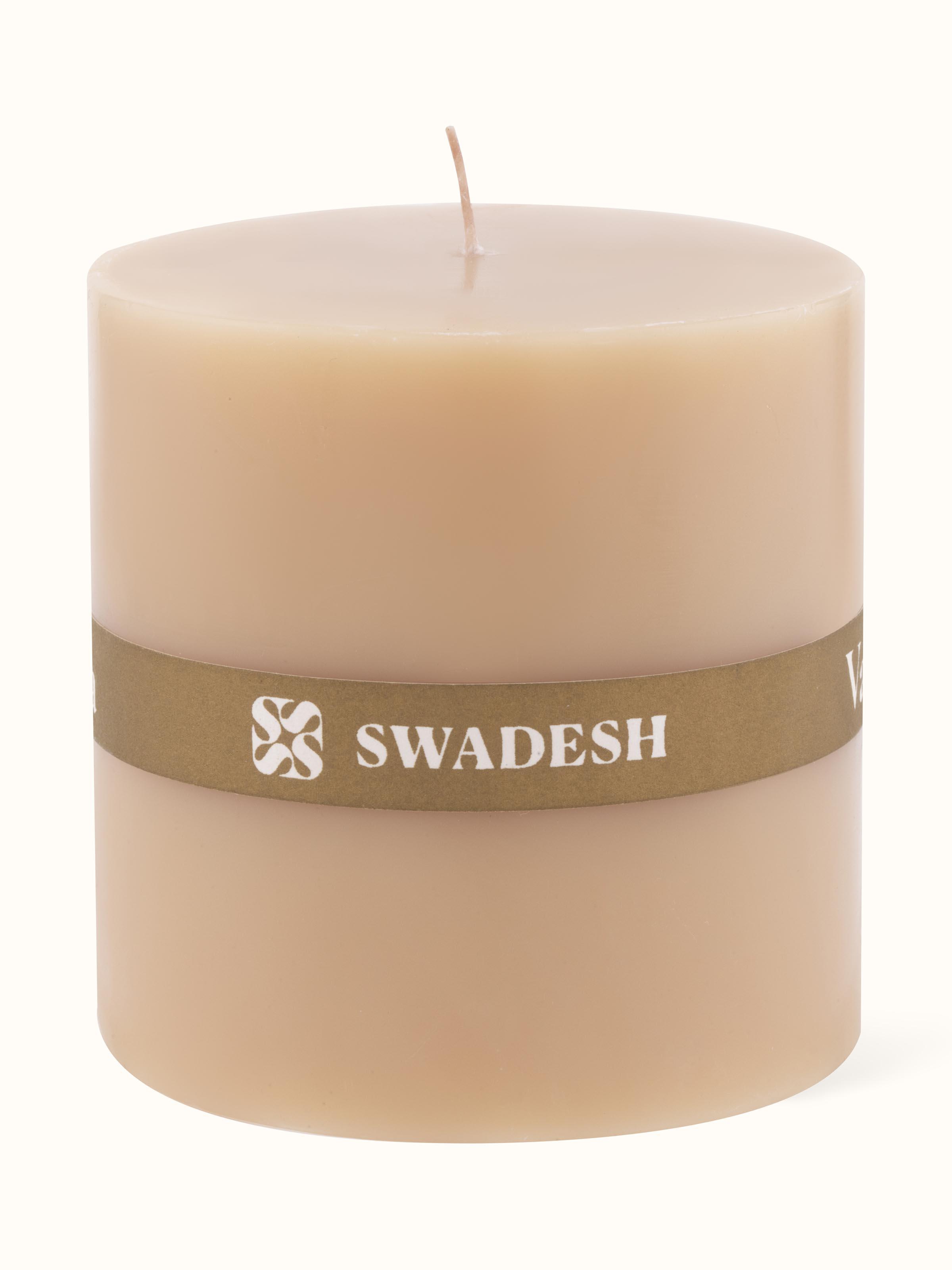 Vanilla pillar candle (3 inches) displayed in a setting to emphasize its decorative use.