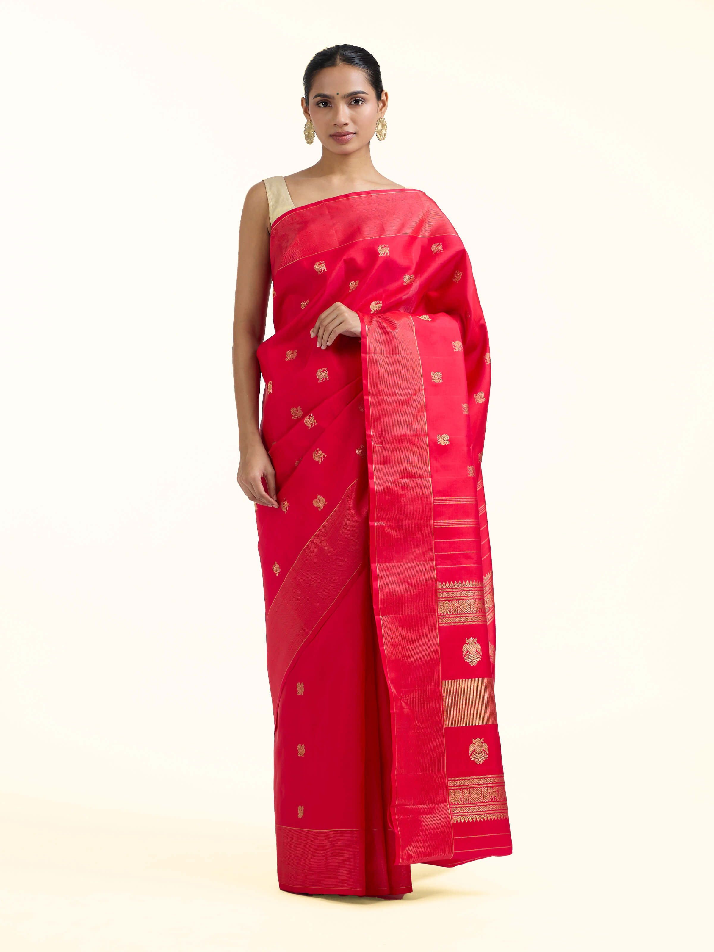 Front view of red silk Kancheepuram saree with rich zari woven motifs