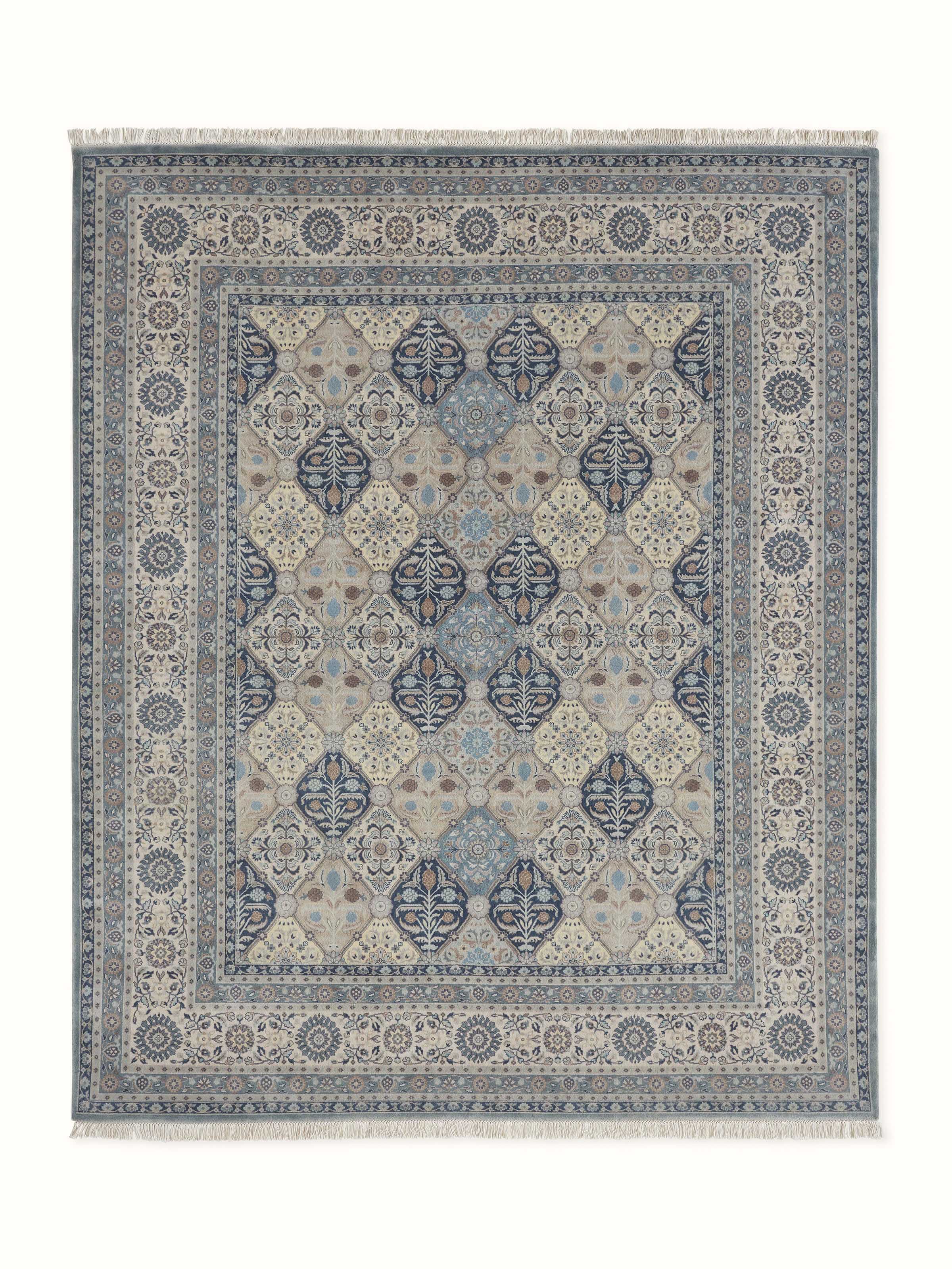 Front-facing view of traditional Sarouk hand-knotted rug in blue and grey tones made from Bhadohi wool