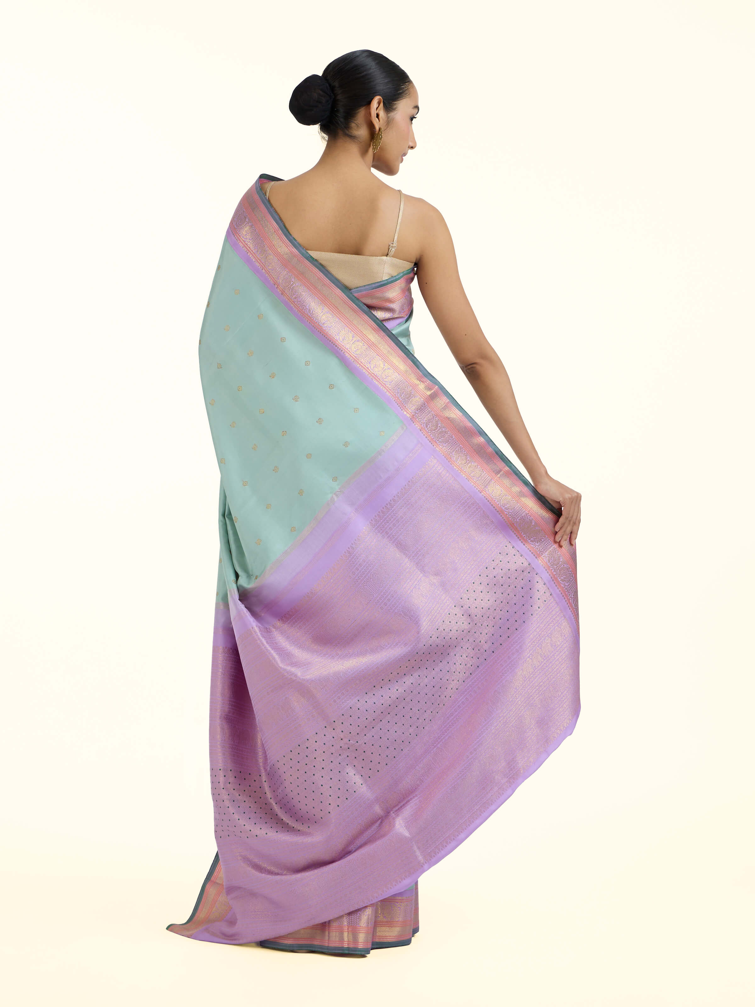 Back view of light blue silk Kancheepuram saree displaying ornate pallu design