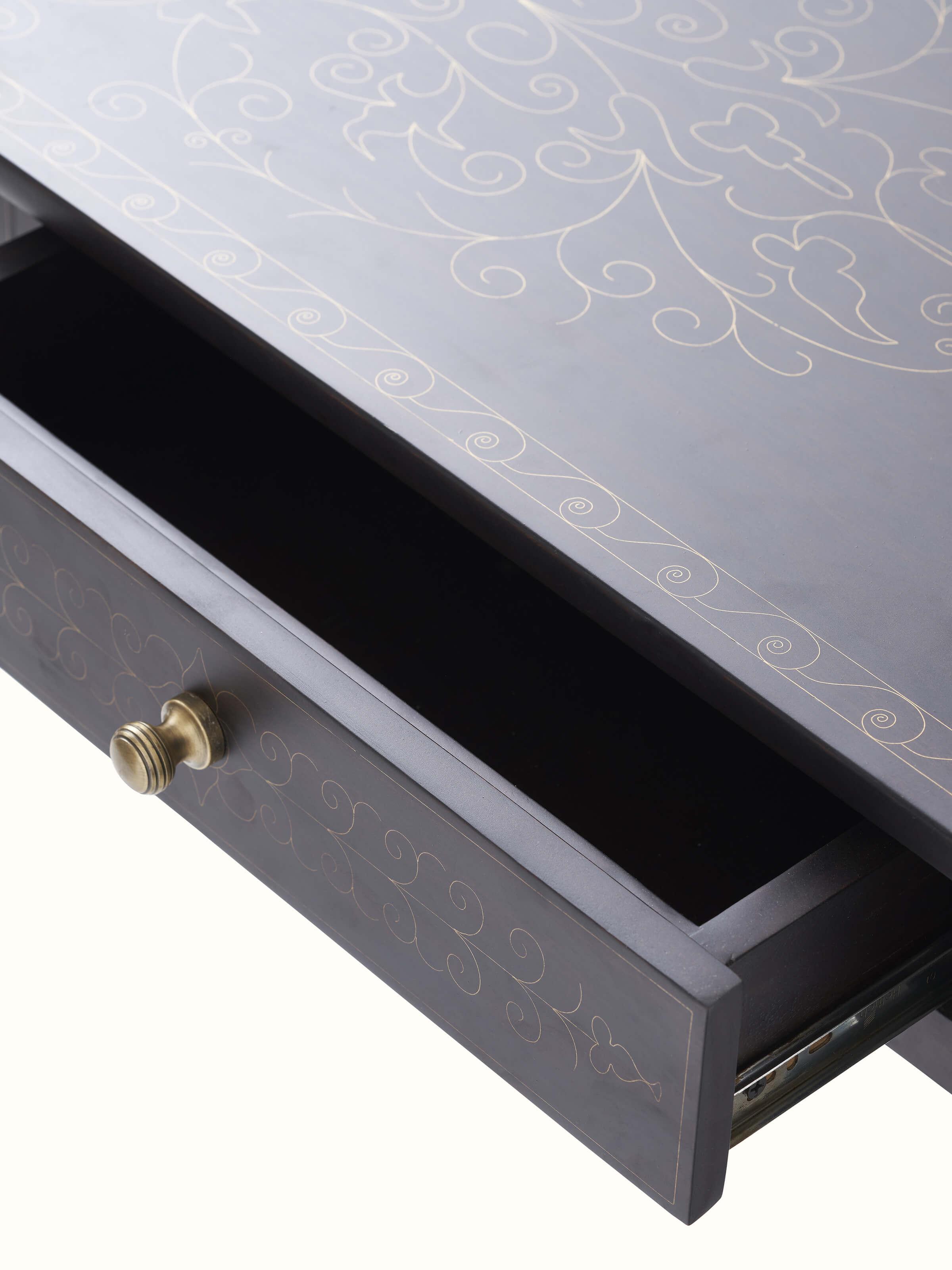 Detailed view of the brass inlay work on the Sheesham wood console table, emphasizing the fine craftsmanship.