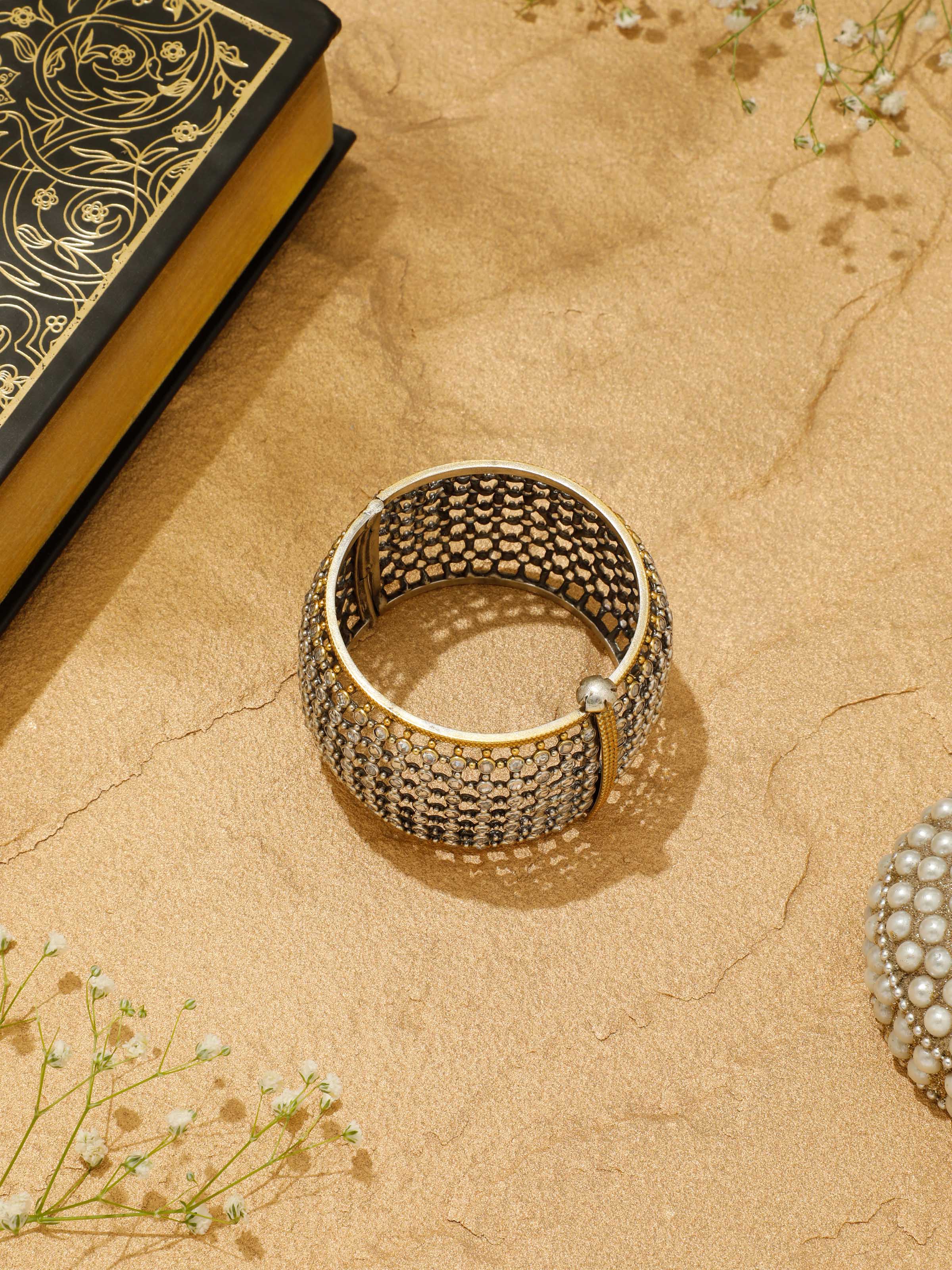 Side top view of Silver Smithing open cuff bangle highlighting hammered texture and polished finish.