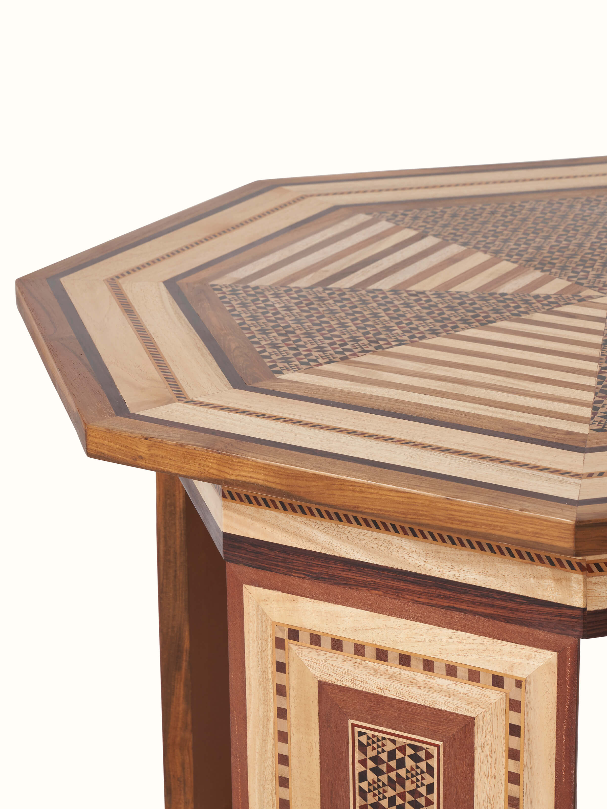 Angled view of Teak Marquetry Coffee Table in a room setting, illustrating its use and design integration