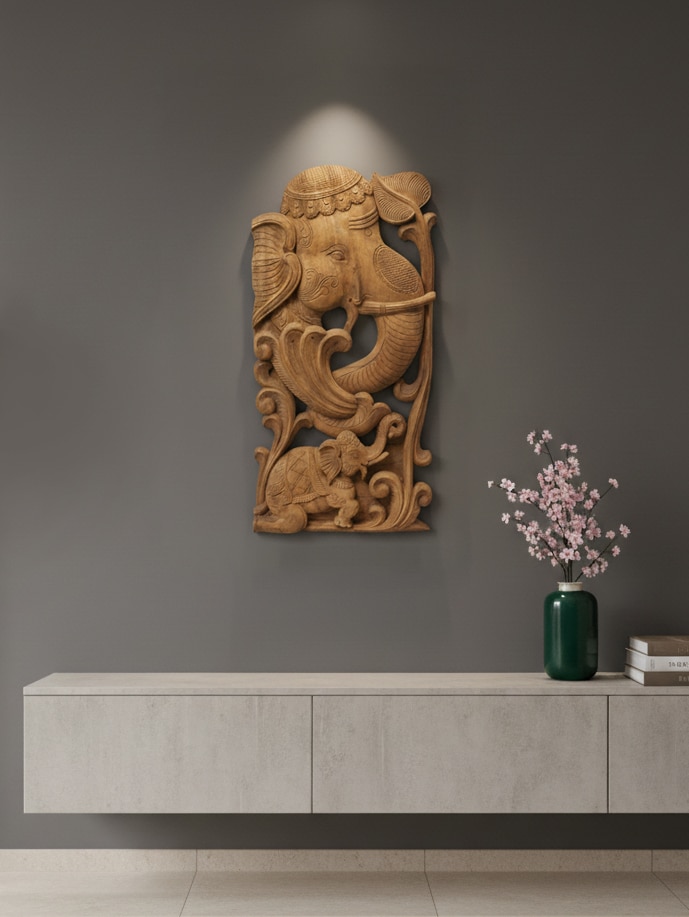 Lifestyle view of tenali carved neem wood elephant face brackets sculpture wall decor