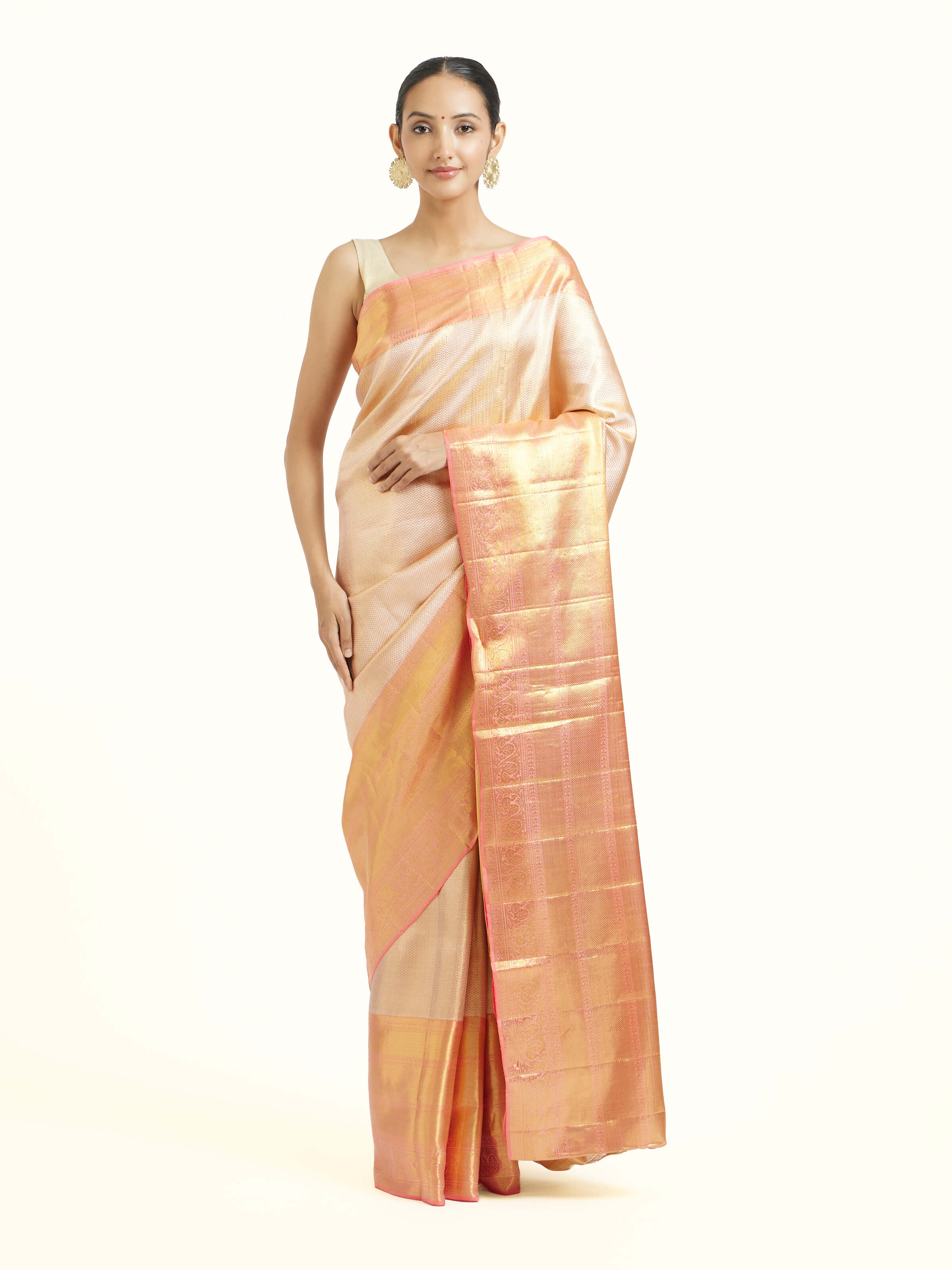 Front view of beige silk Kancheepuram saree with classic zari motifs