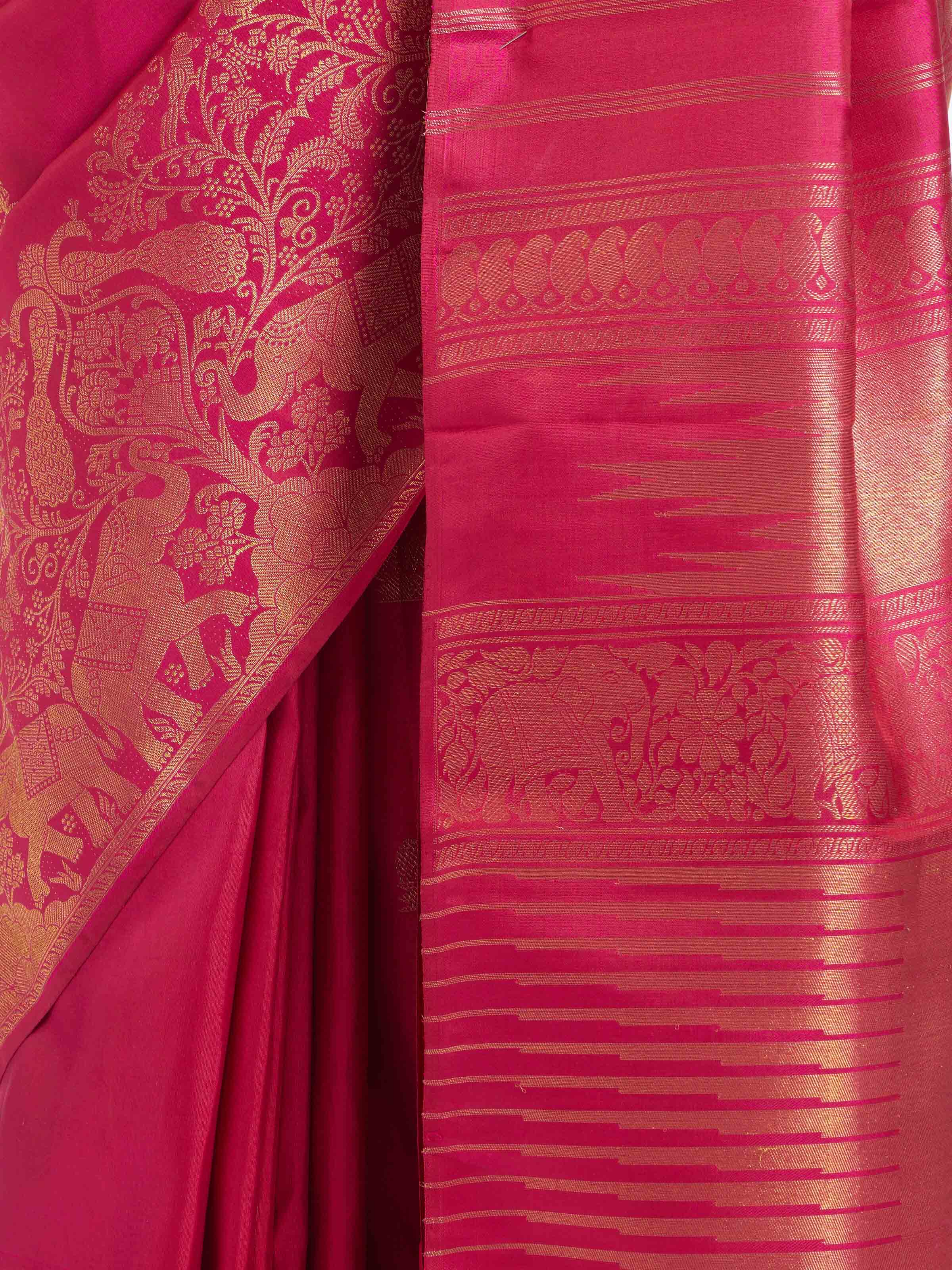Detail view of red silk Kancheepuram saree showcasing intricate zari craftsmanship