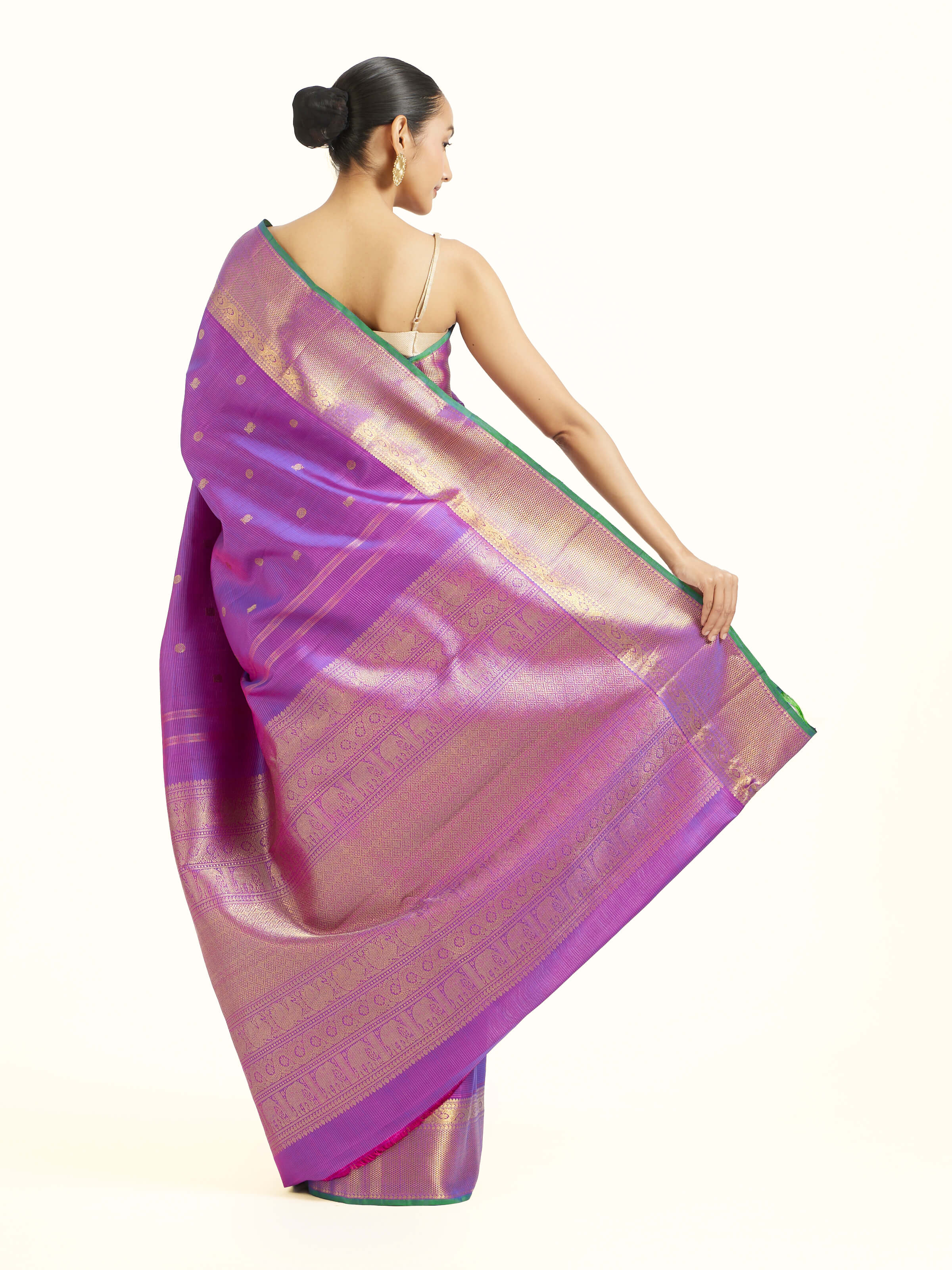 Back view of purple silk Kancheepuram saree displaying grand pallu