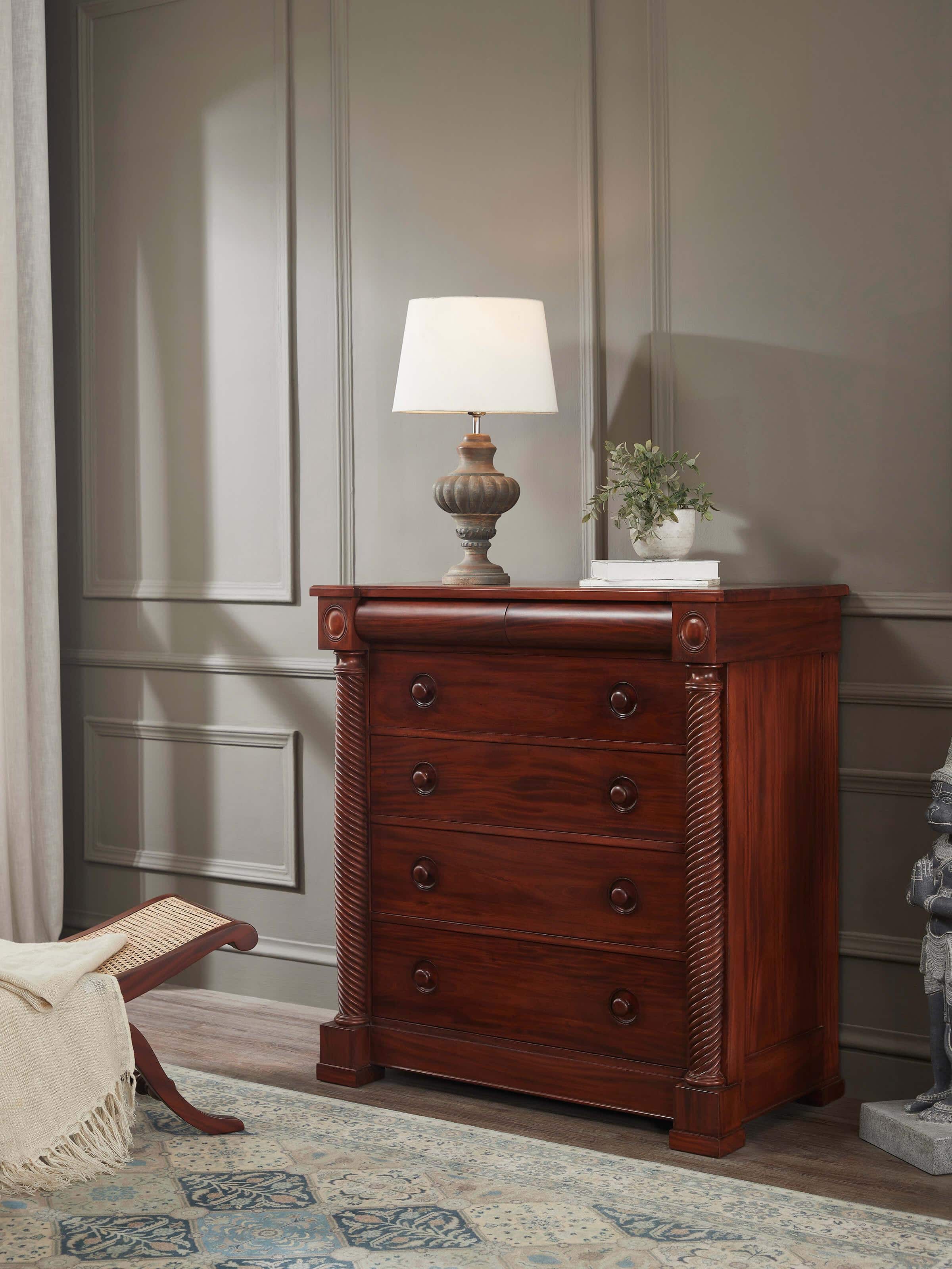 Lifestyle view of Mahogany wood chest of drawer highlighting refined craftsmanship and placement in a modern setting