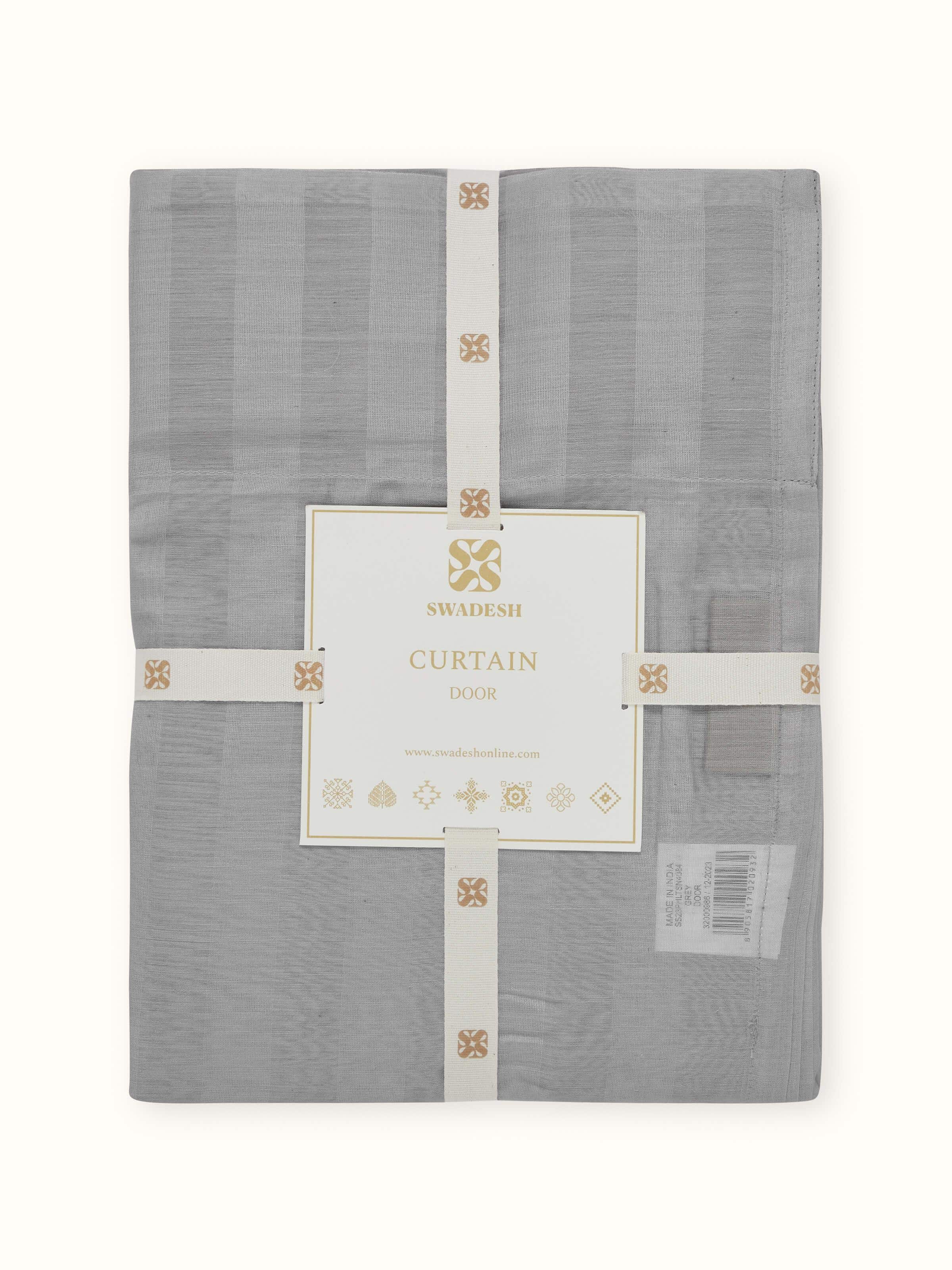 Detailed fabric shot of the wide stripes and delicate weave of the sheer curtain