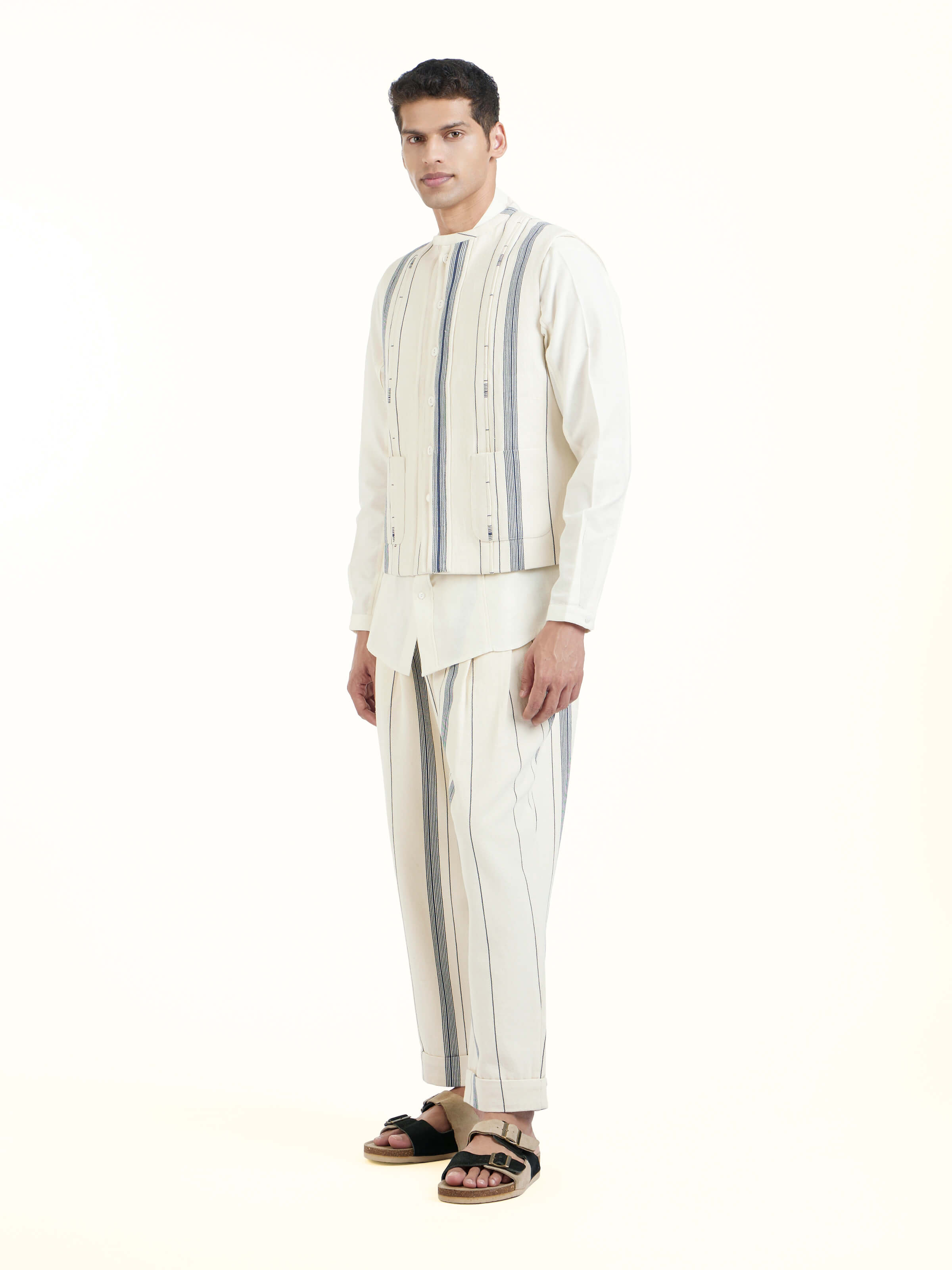 Side view of ivory cotton handloom sleeveless jacket highlighting structured fit