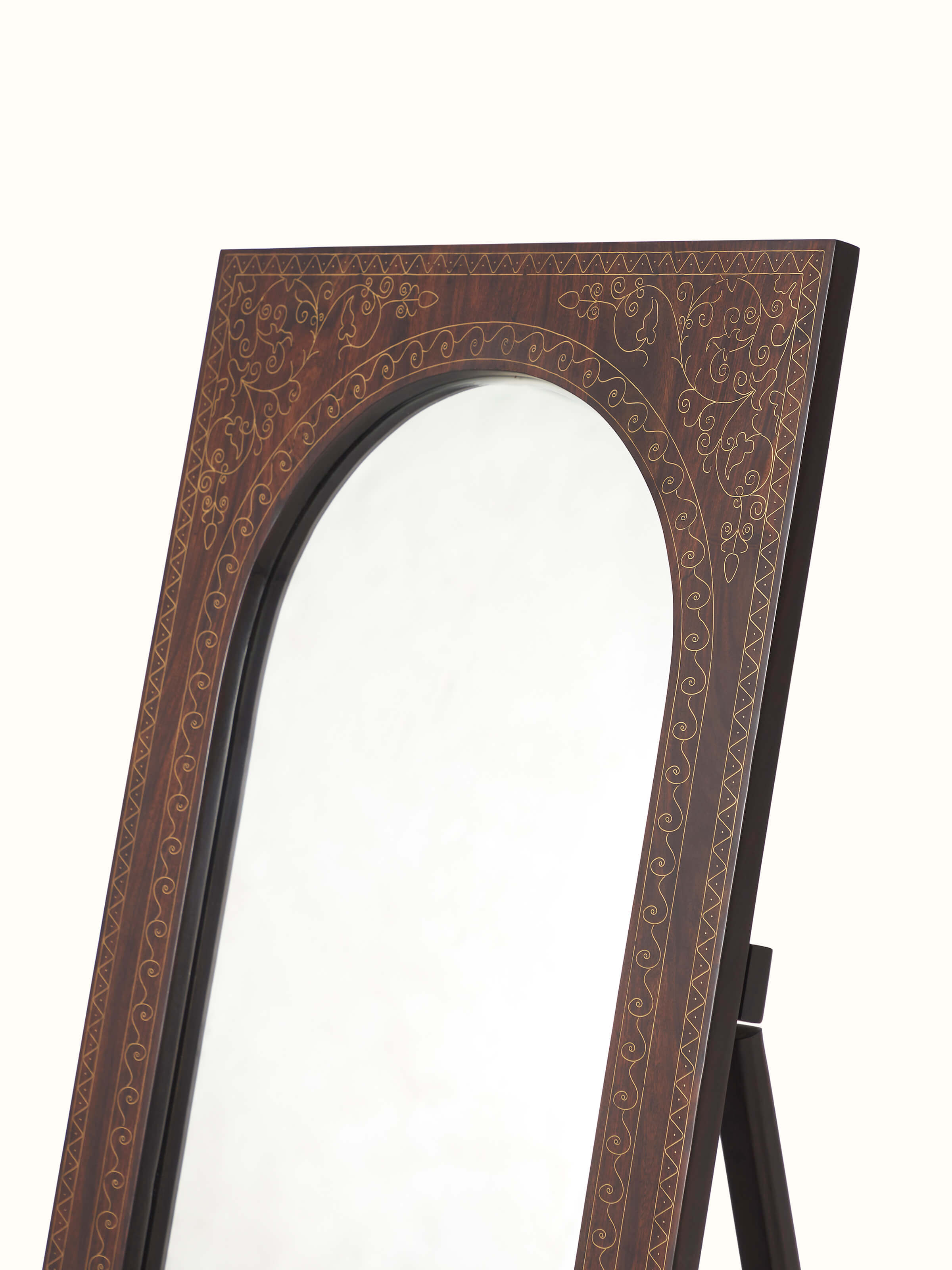 Close-up of the brass detailing on Sheesham Wood & Brass Tarkashi Mirror, focusing on the intricate patterns and design