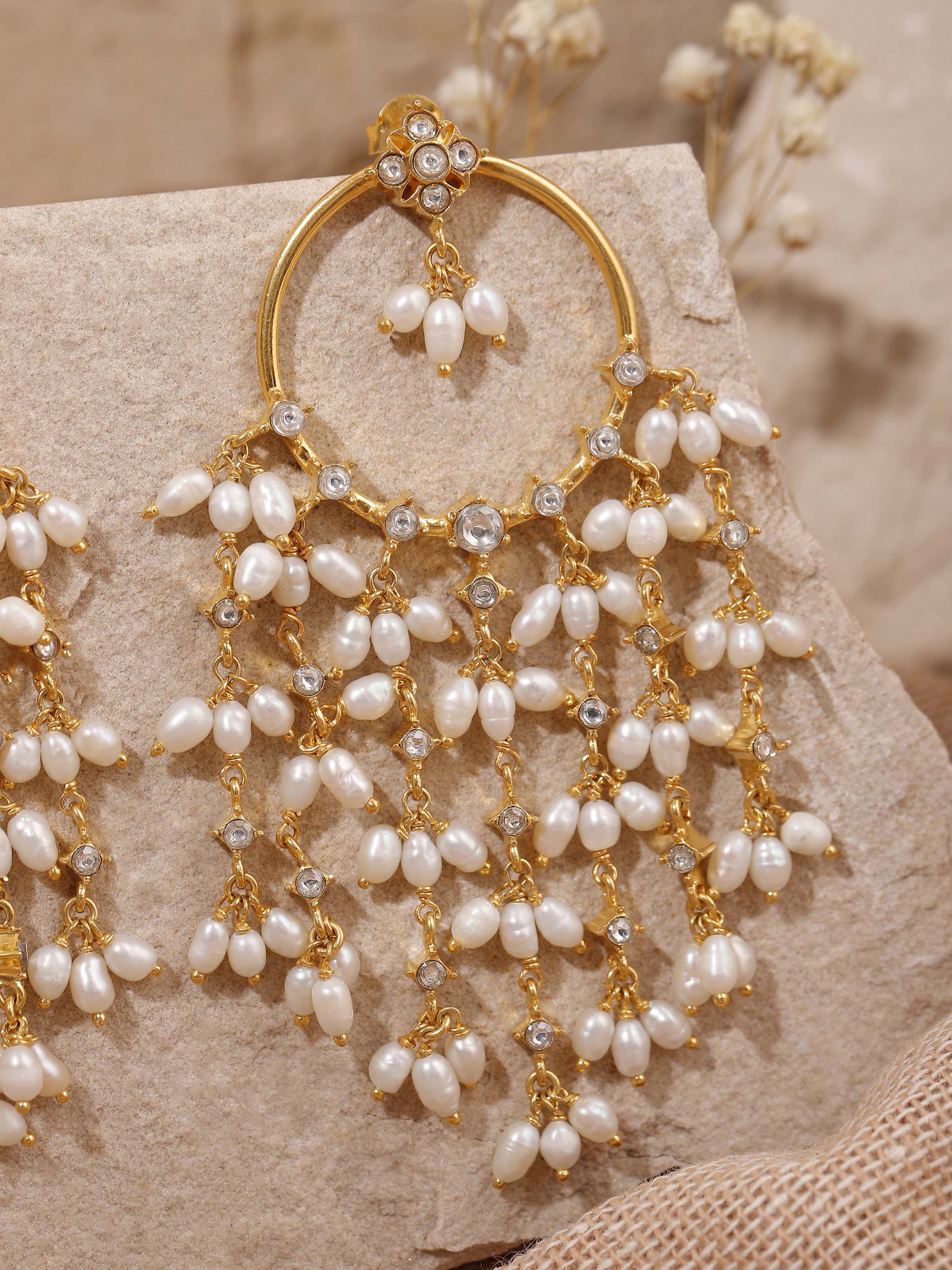 Overhead view capturing the radial symmetry and ornamentation of the drop silhouette.