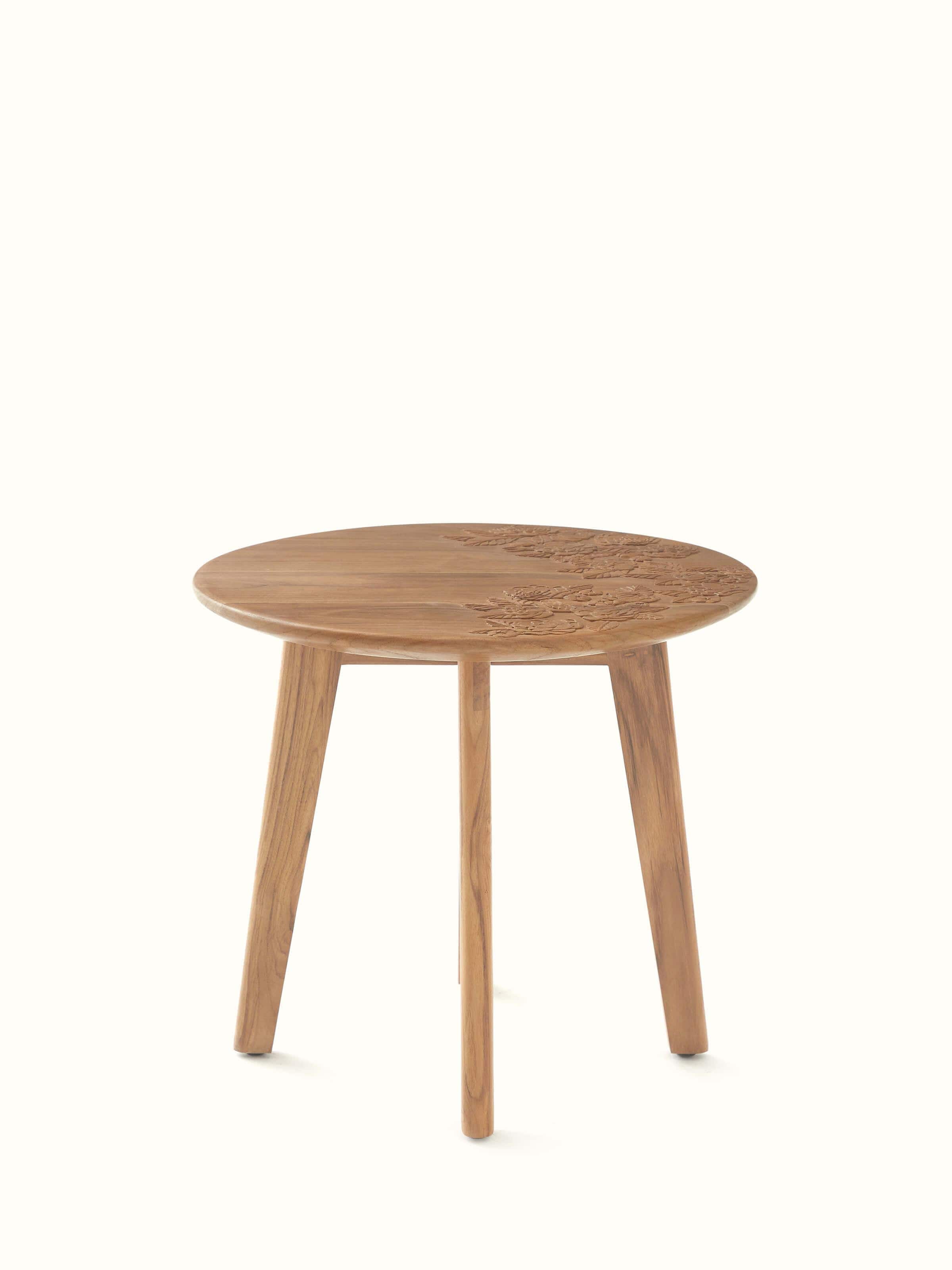 Front view of the carved teak wood round side table, showcasing intricate detailing and craftsmanship