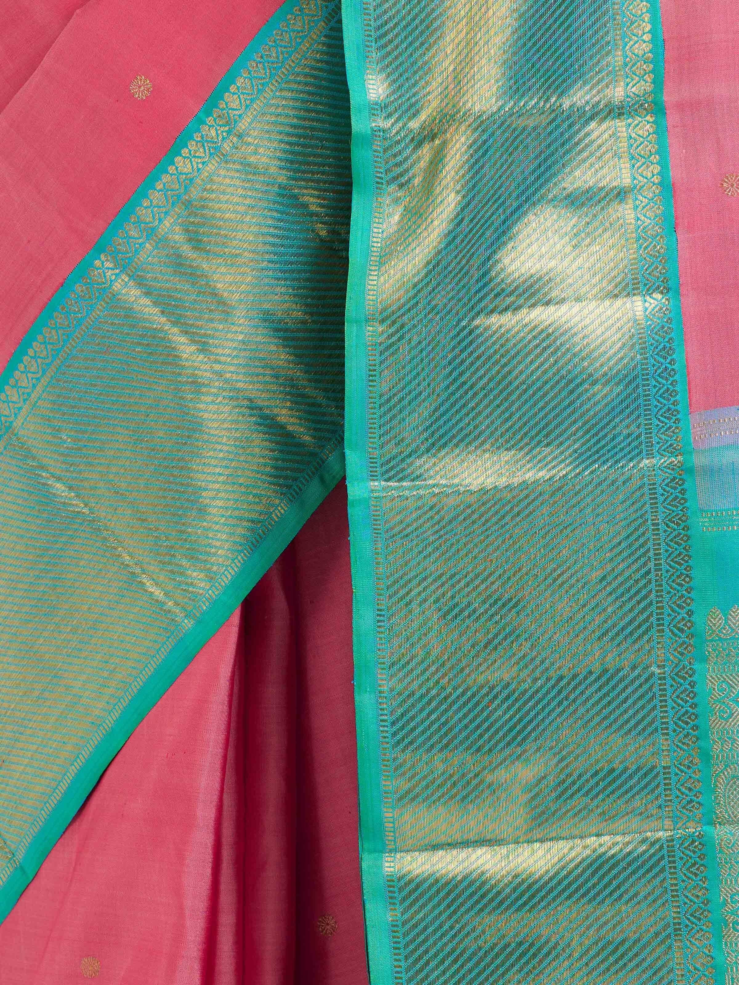 Detail view of wine silk Kancheepuram saree highlighting silk texture and zari work