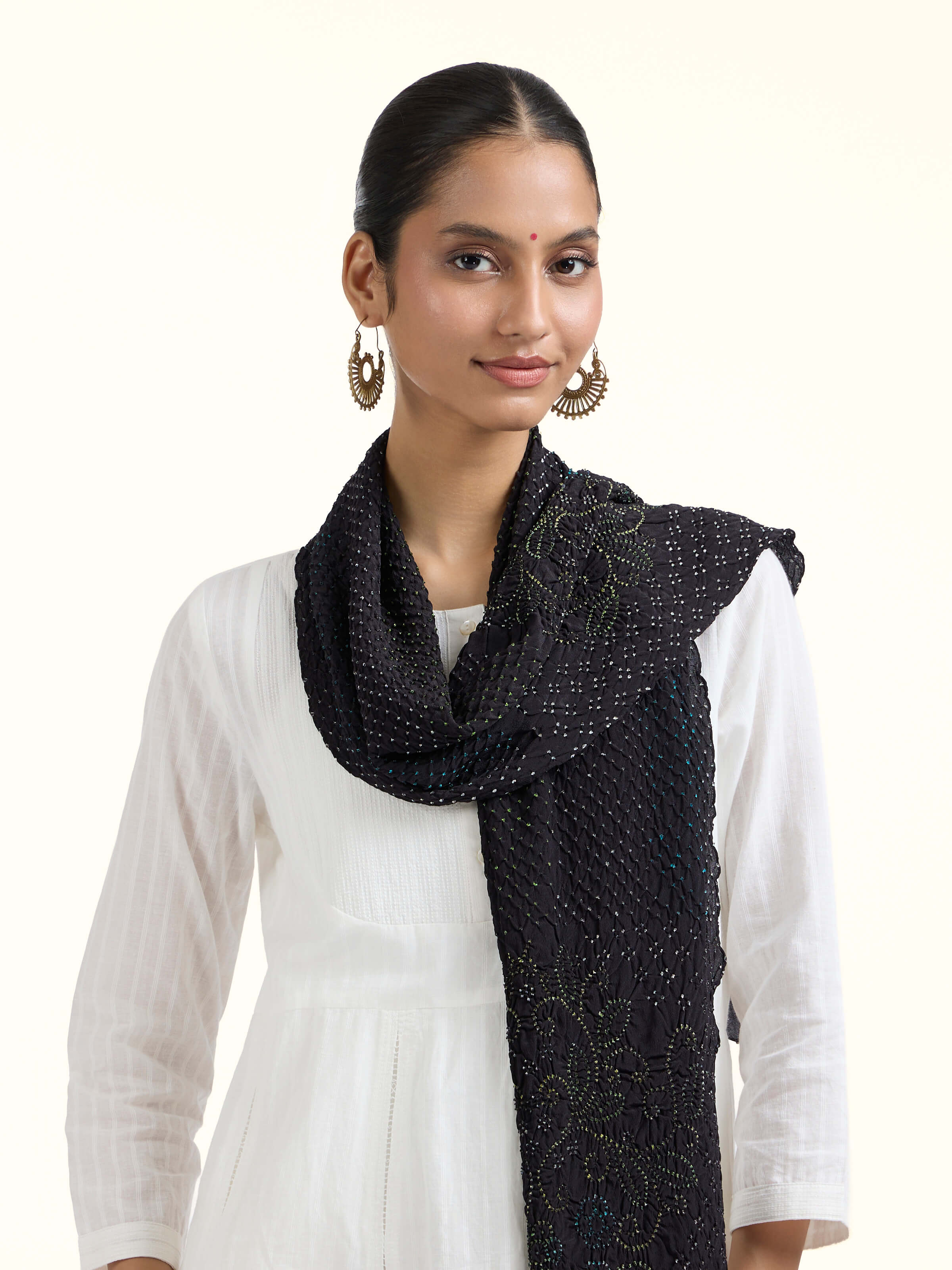 Angled view of Black Bandhani Tie & Dye Silk Stole revealing the depth of its color and intricate pattern