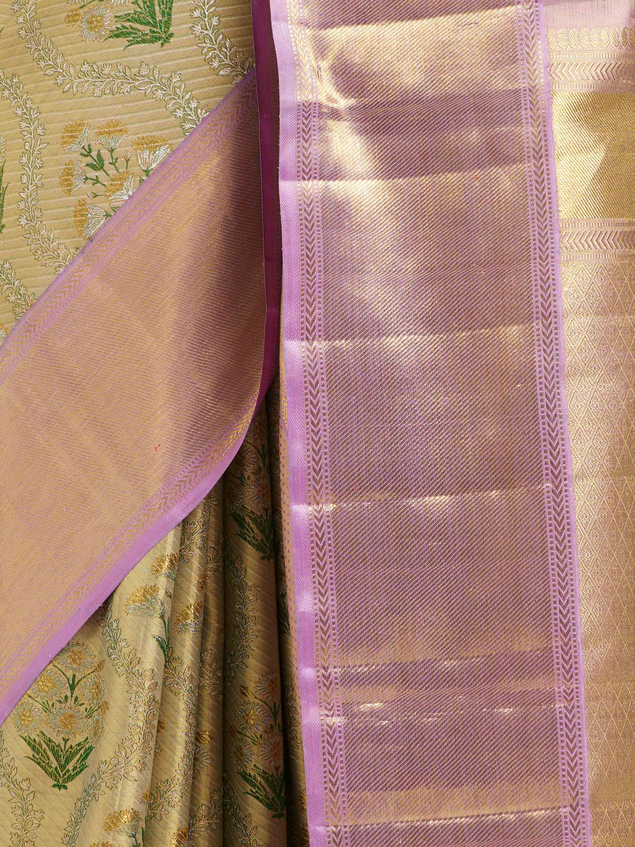Detail view of gold silk Kancheepuram saree showing silk texture and zari work