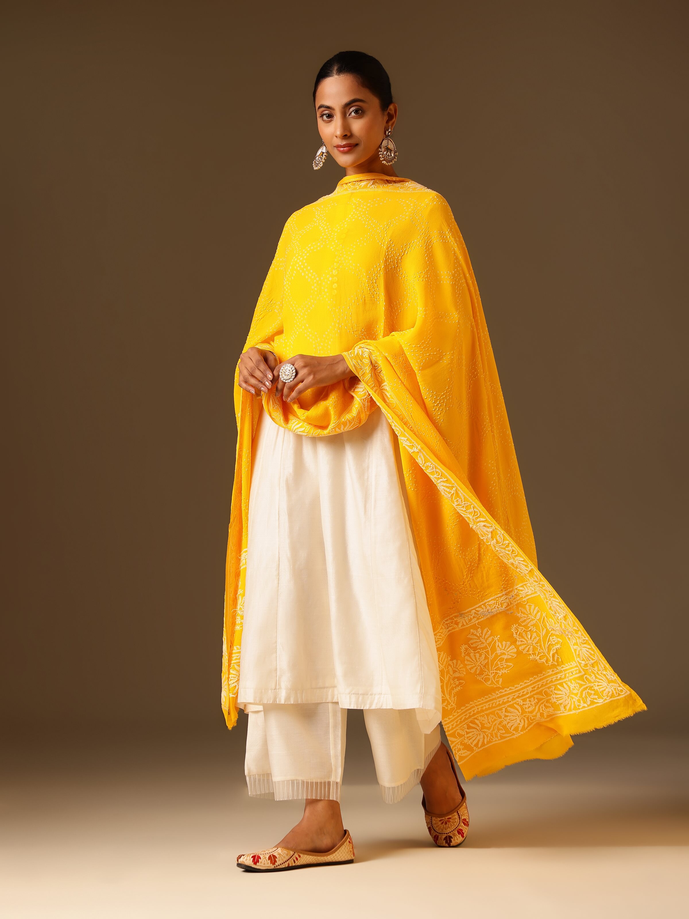 Side view of yellow georgette bandhani tie and dye dupatta showcasing light drape