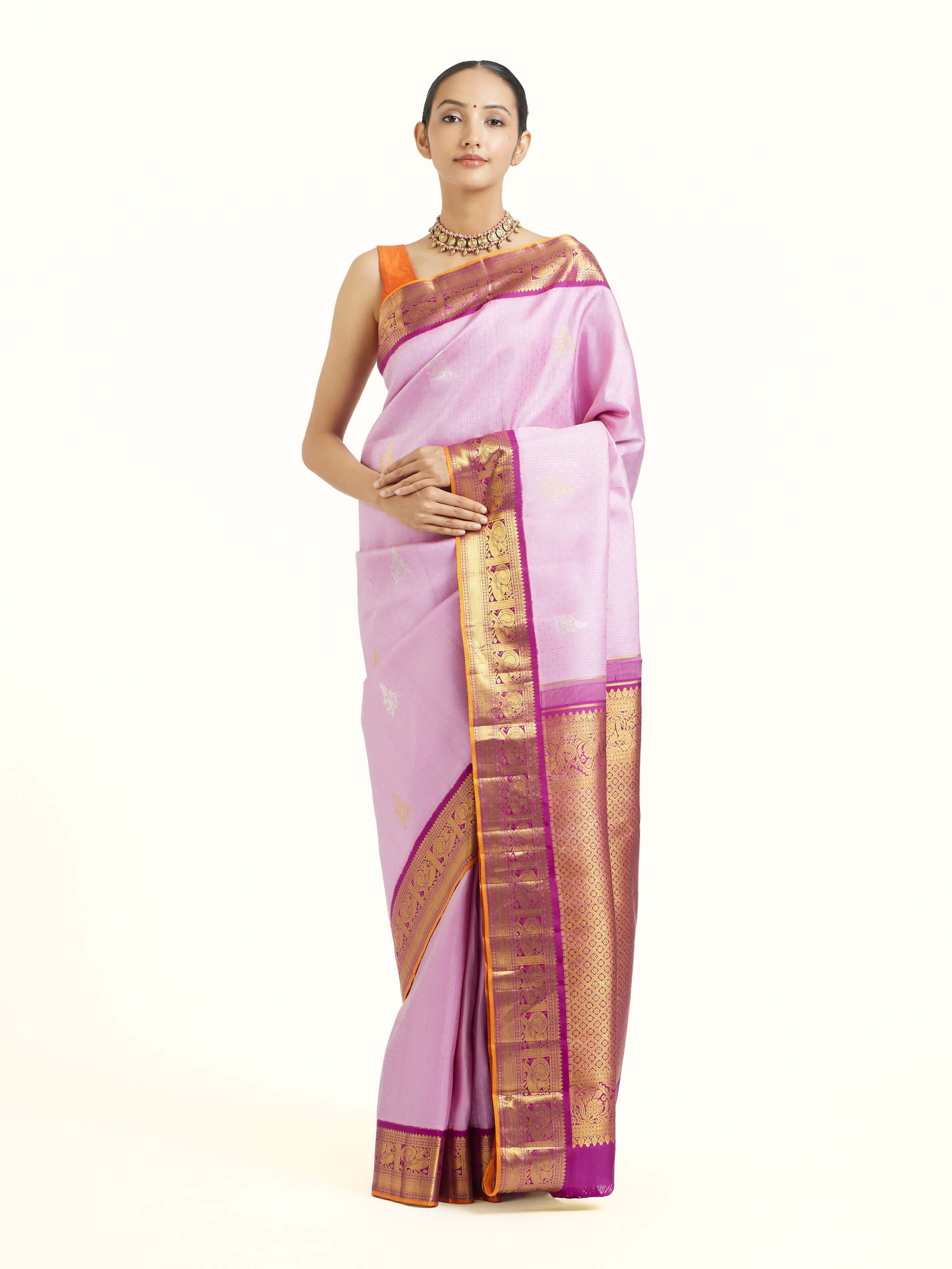 Front view of lavender silk Kancheepuram saree with rich zari woven motifs