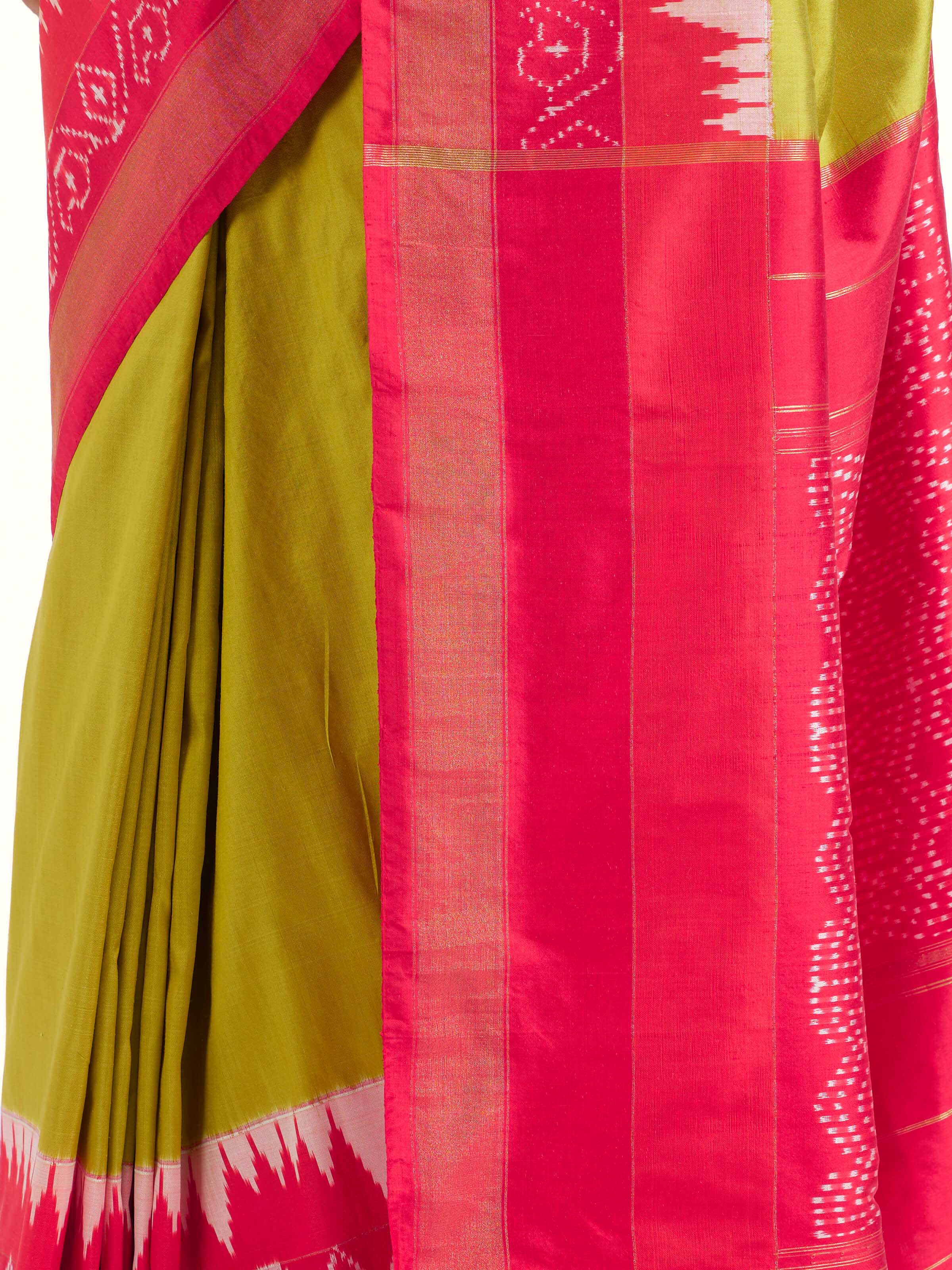 Detail view of mustard mulberry silk ikat saree showing silk texture
