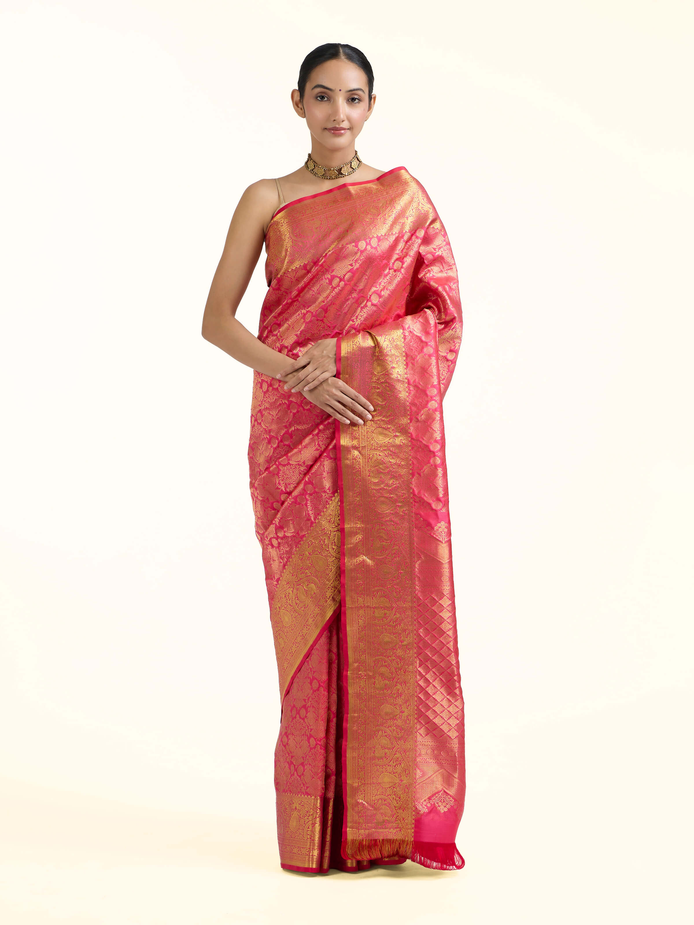 Front view of red silk Kancheepuram saree with lustrous silk and zari motifs