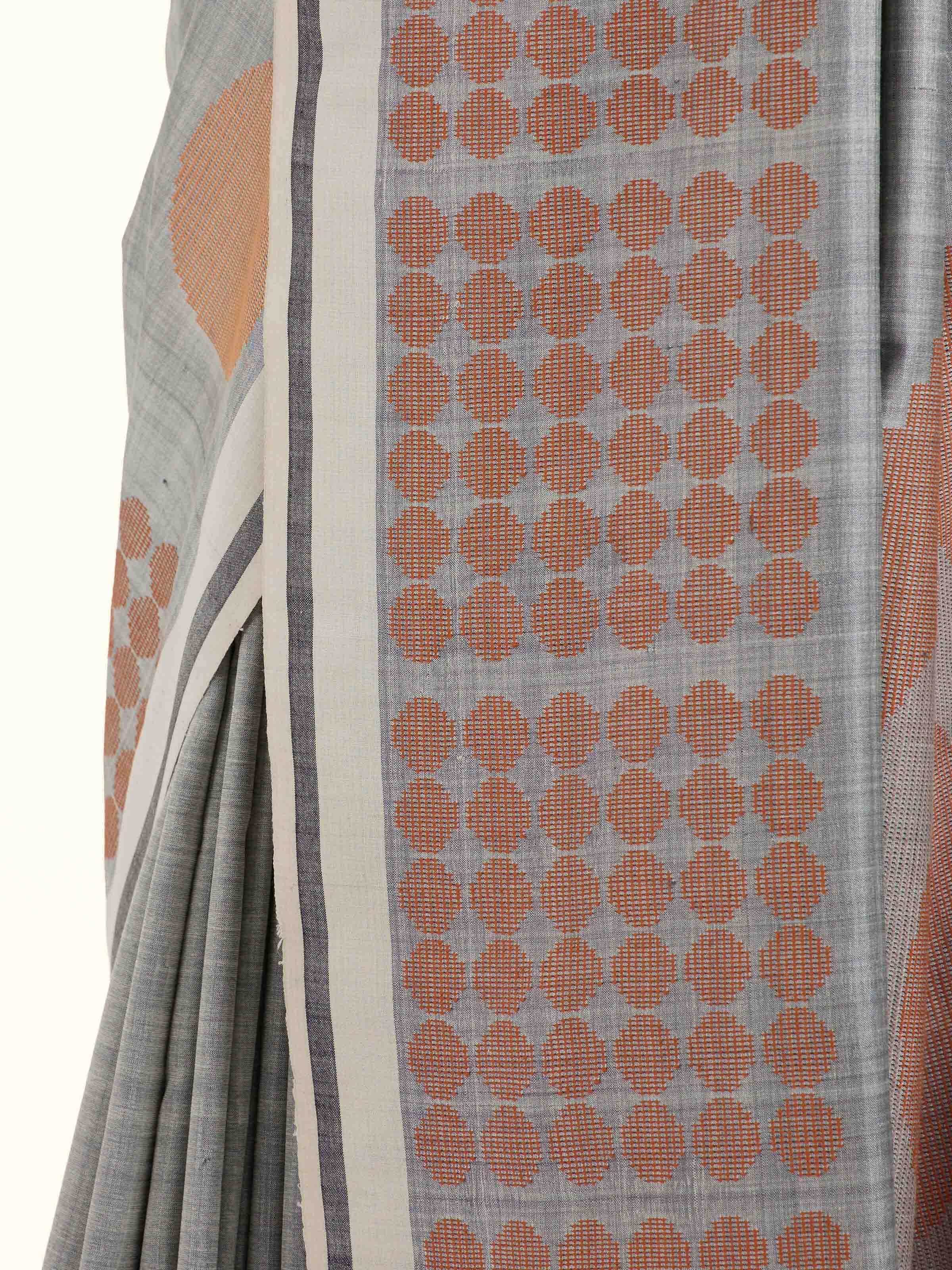 Detail view of grey silk extra-weft saree showing silk texture and craftsmanship