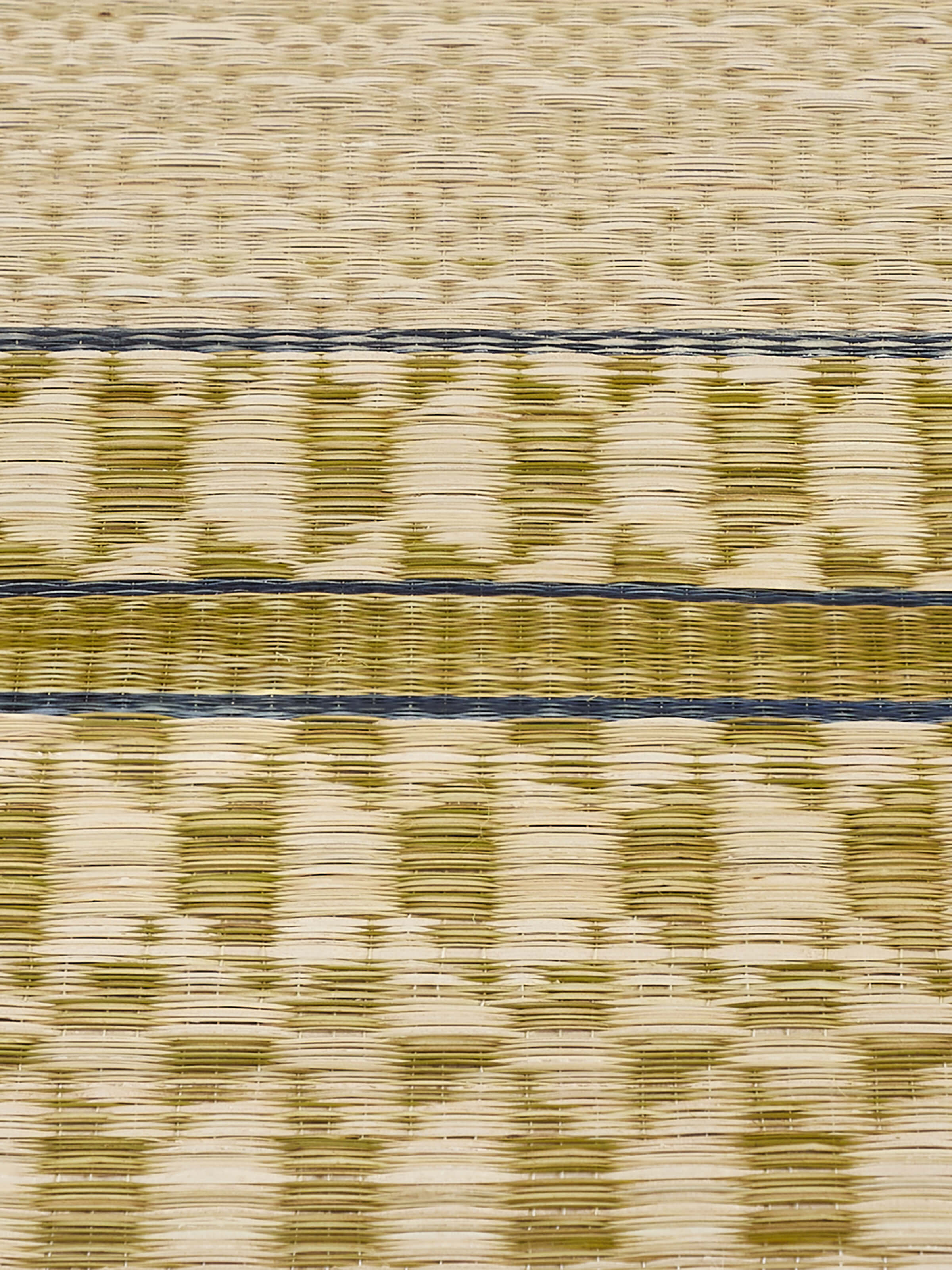 Close-up of geometric weave pattern on Madurkathi green table runner