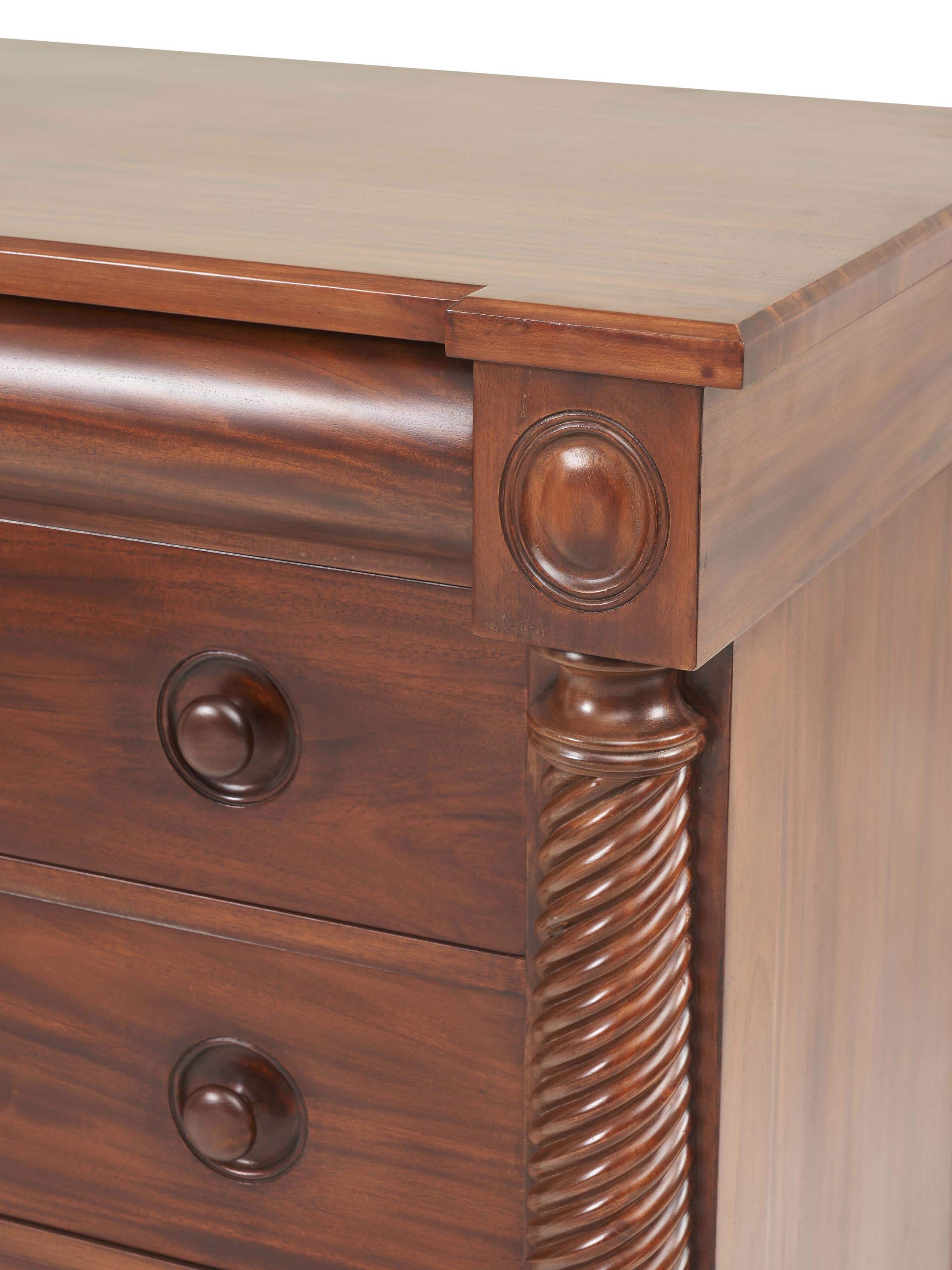 Detail shot of Mahogany wood chest of drawer showcasing close-up of drawers and grain texture