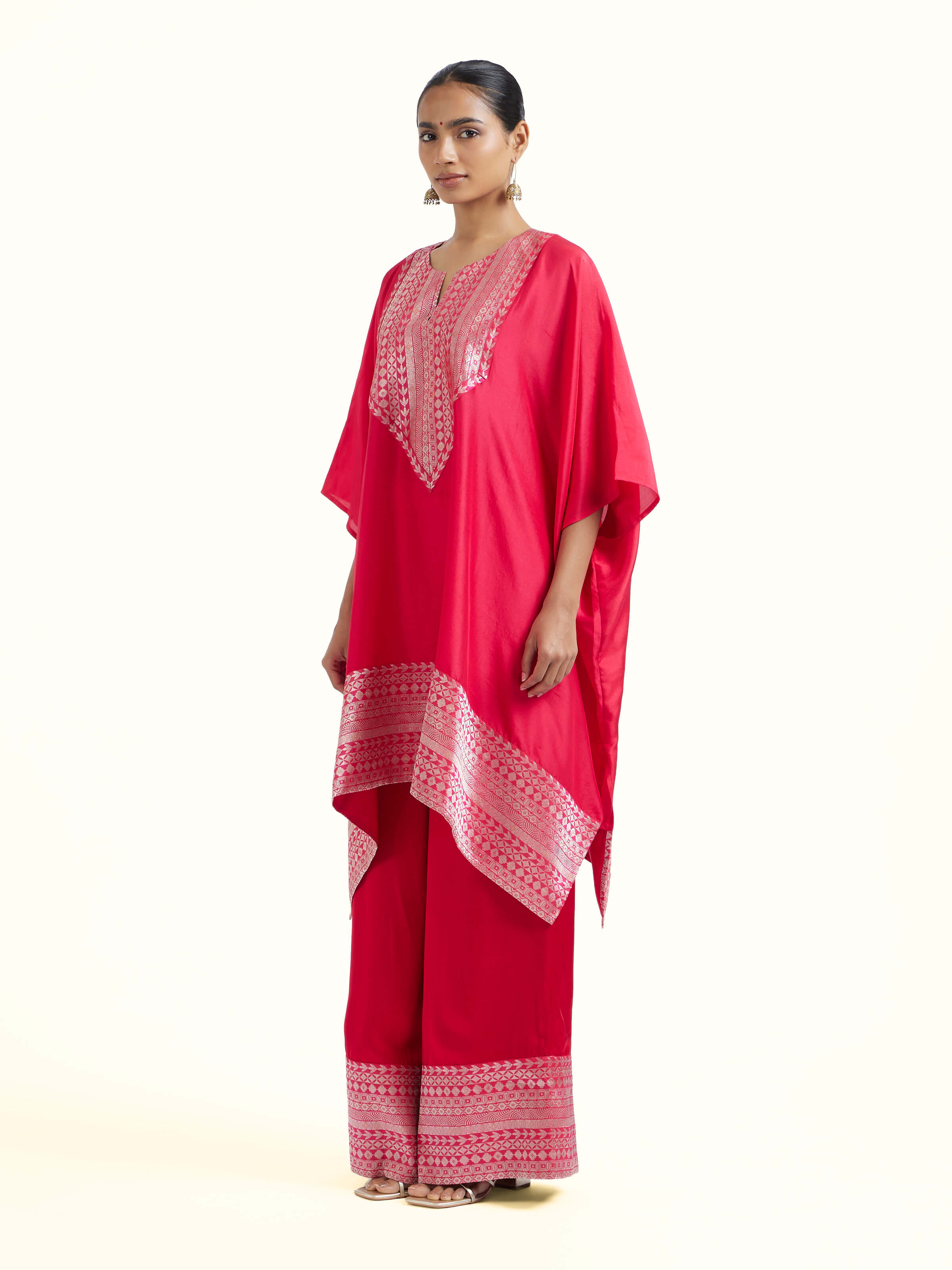 Side view of red silk Banarasi co-ord set highlighting tailored fit and texture