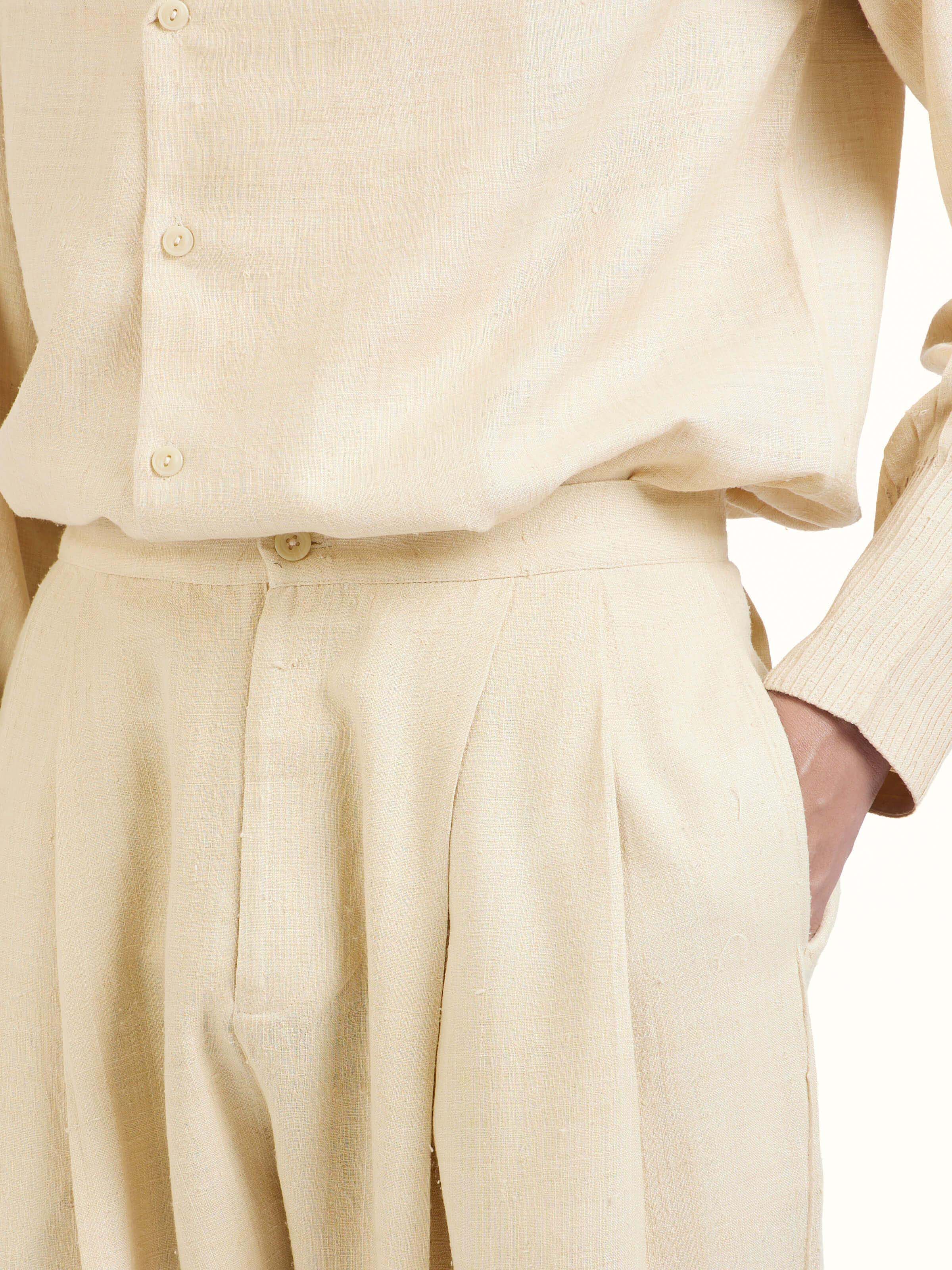 Detail view of off-white silk handloom straight pants showing handwoven silk