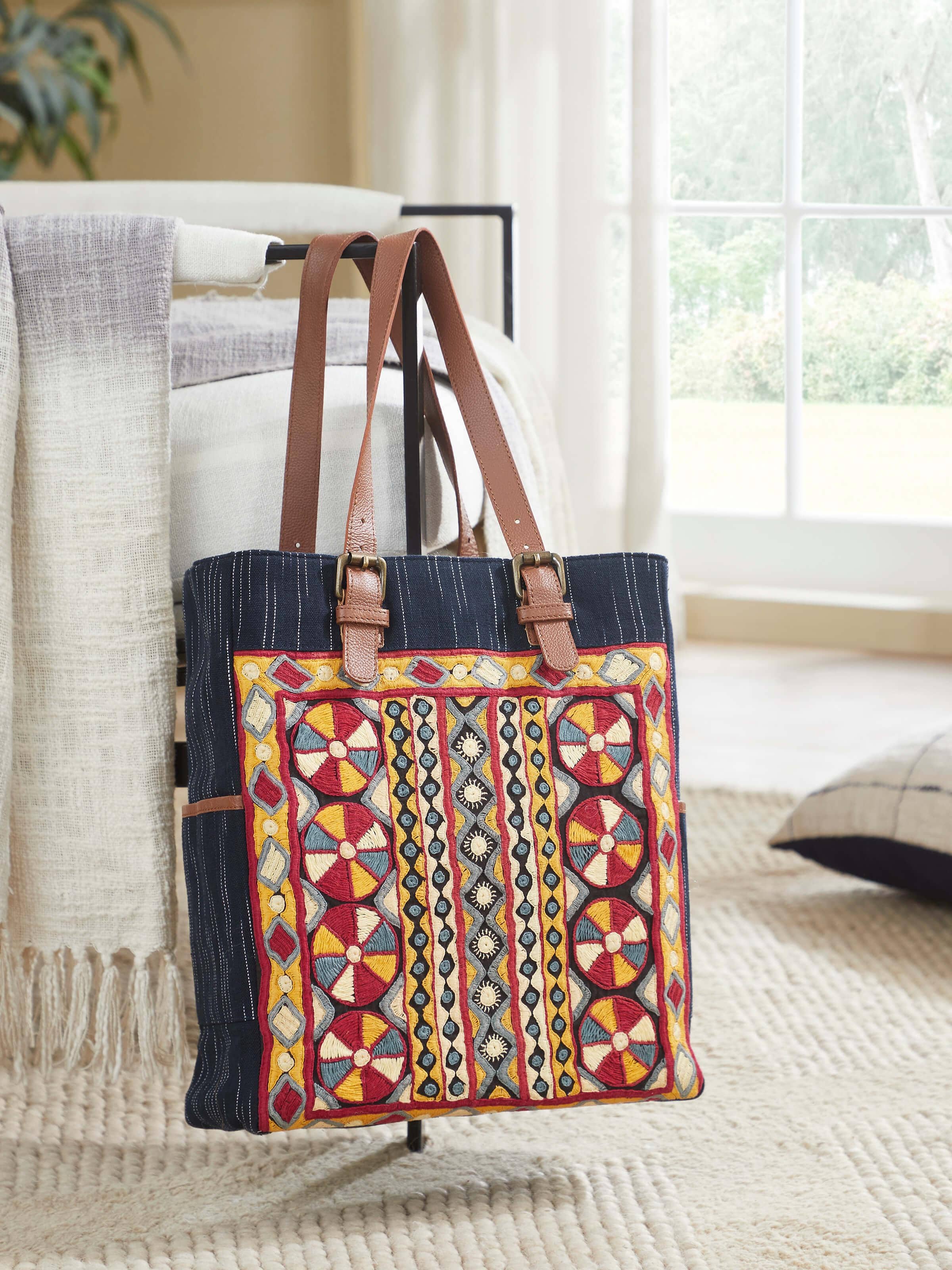 Lifestyle view of Grey Leather & Textile Embroidered Tote Bag showing spacious design and texture.