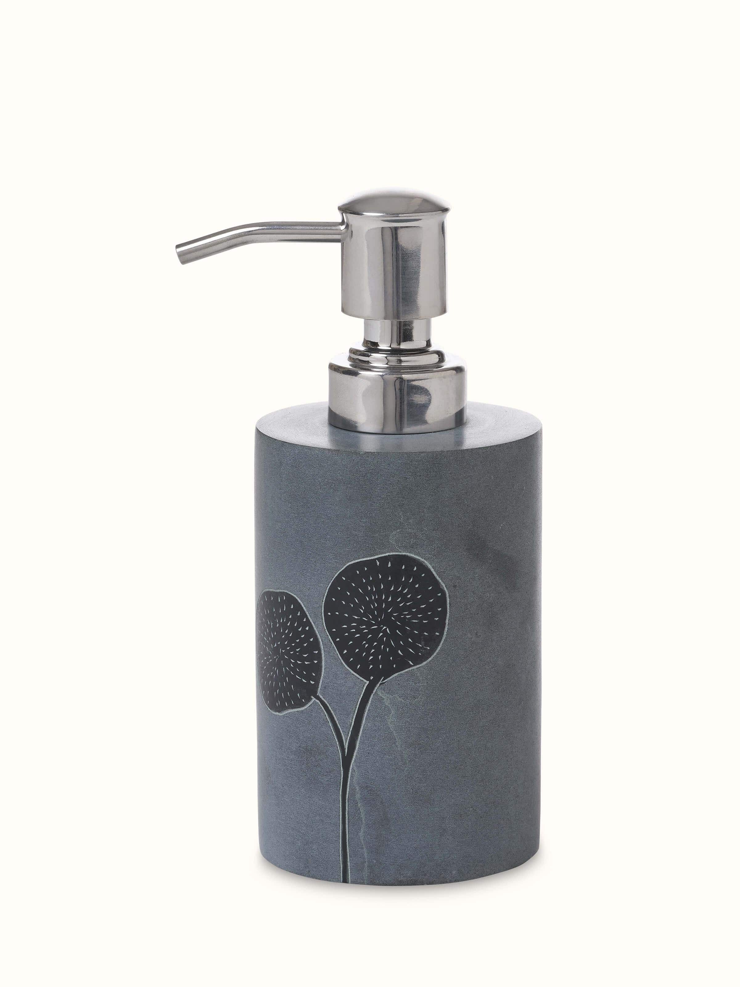 Front view of carved stone soap dispenser highlighting the intricate design and refined craftsmanship.