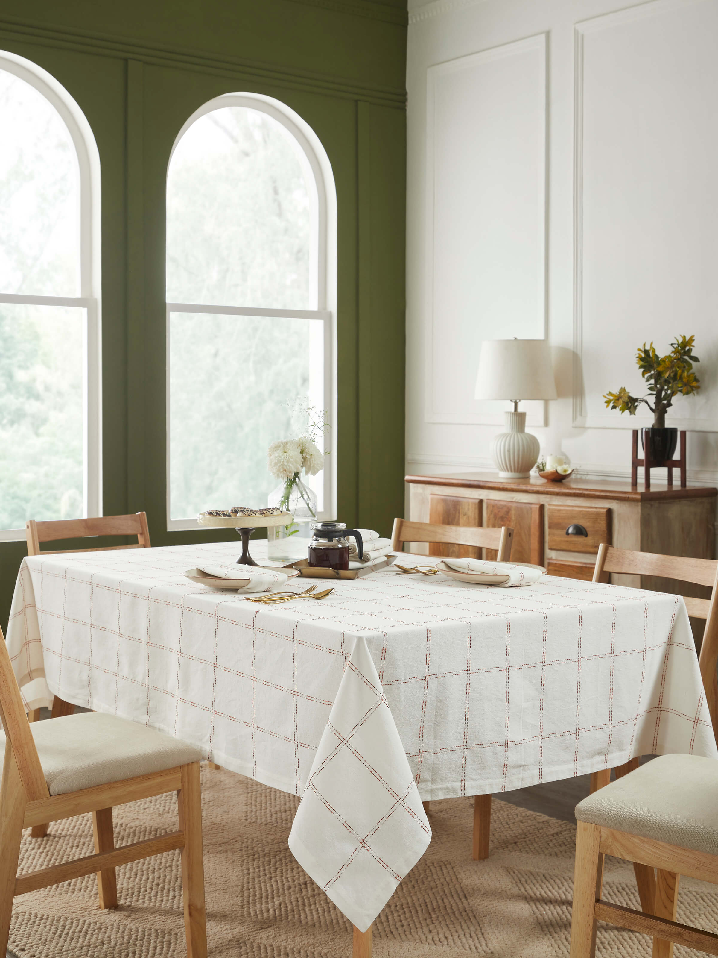 Top-down shot highlighting the rich rust check pattern and fine handloom weaving