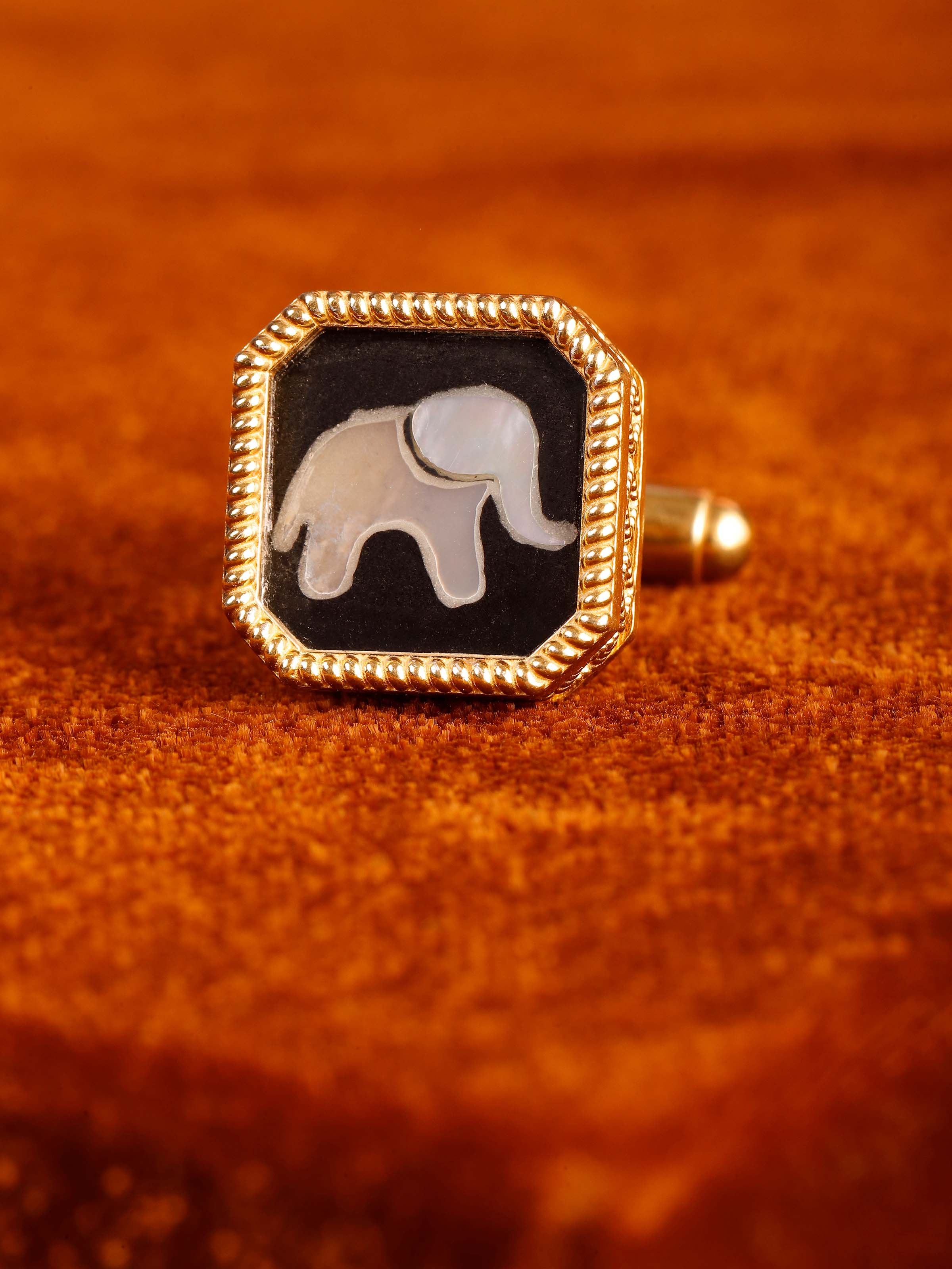 Close-up of Parchinkari inlay work on silver cufflinks