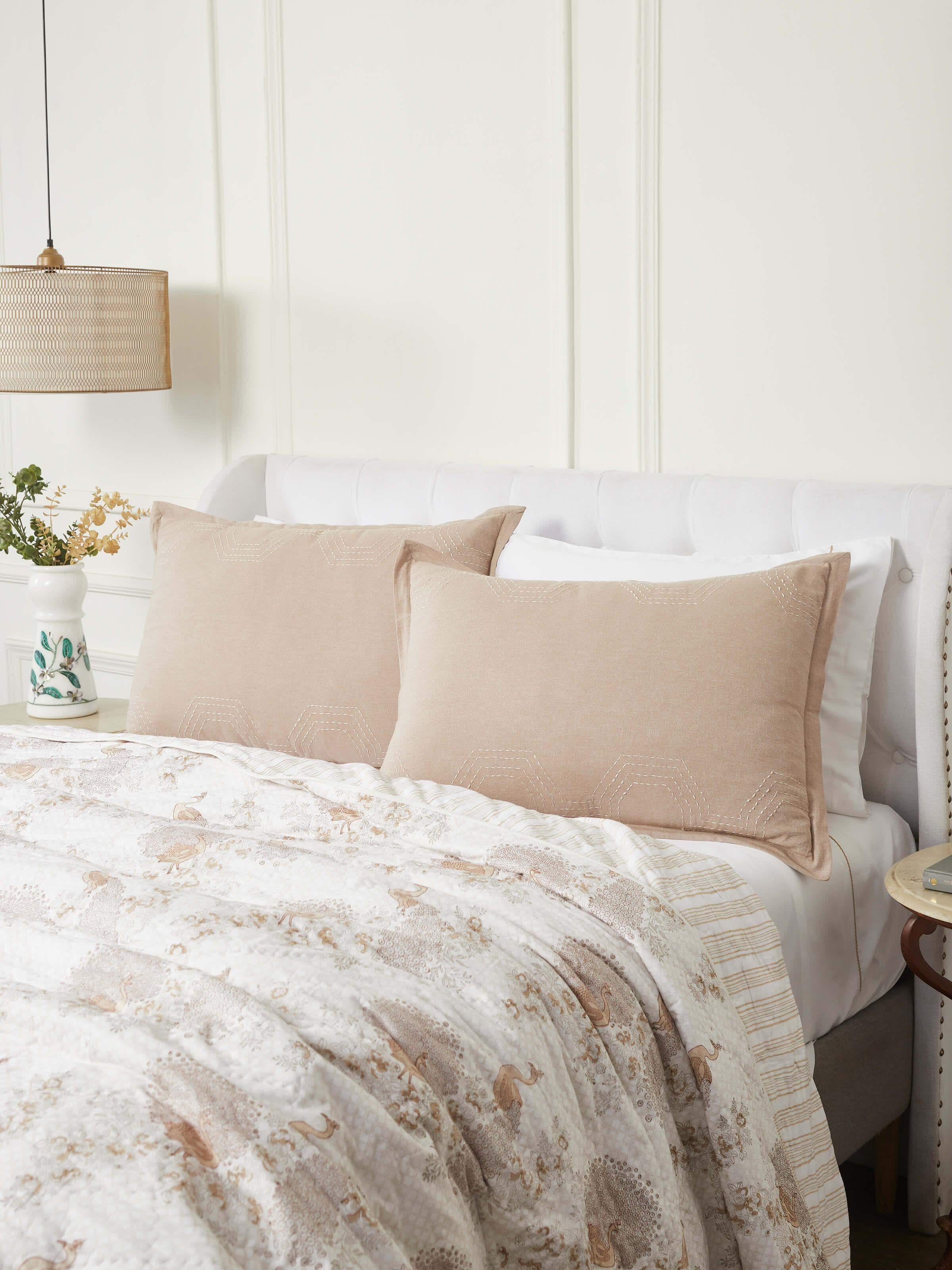 Lifestyle image showing Kahani Brown Kantha Embroidery Pillow Shams arranged on a bed