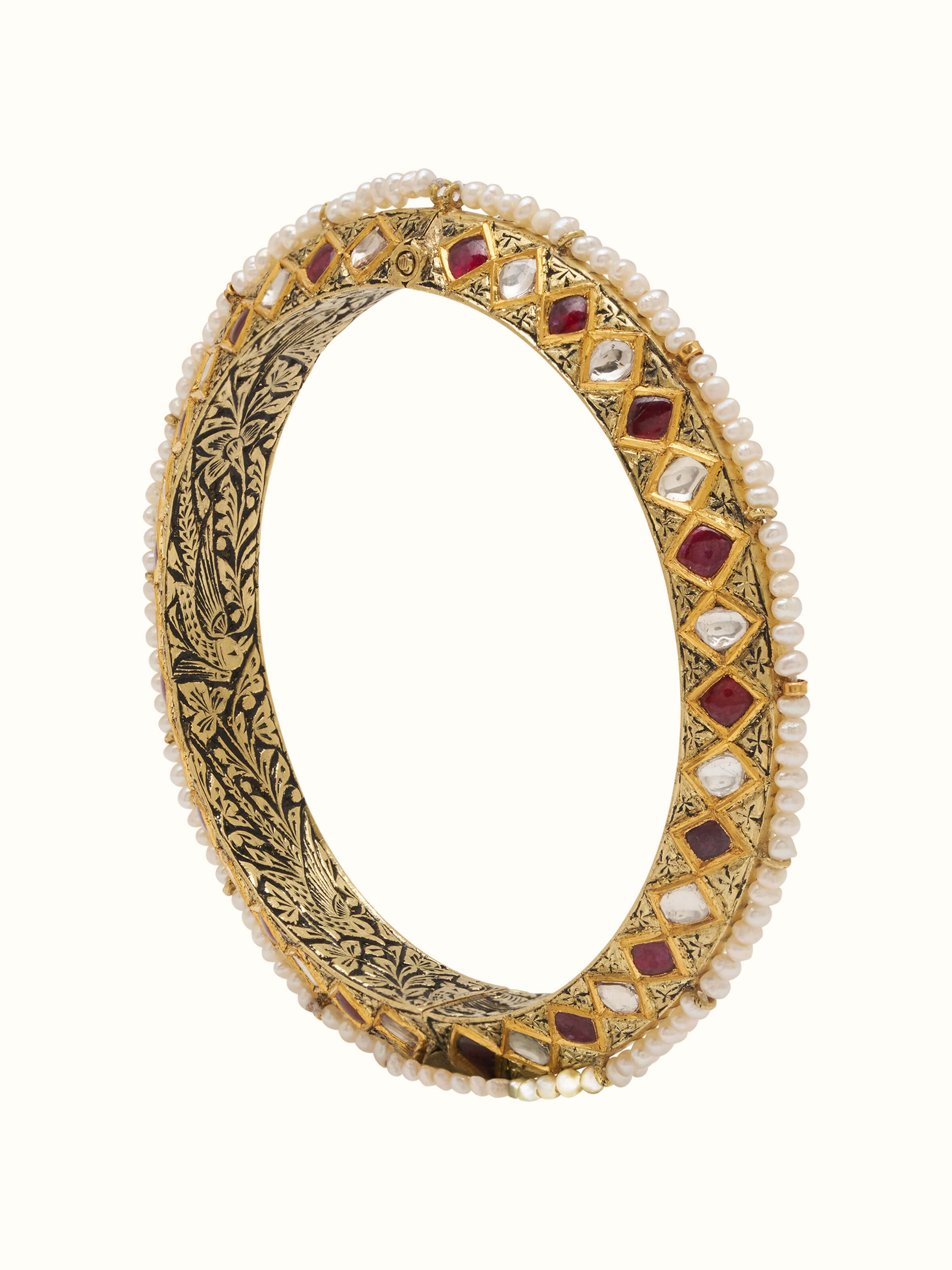 Elegant 18 karat gold bangle displayed from the front showcasing its shine and design