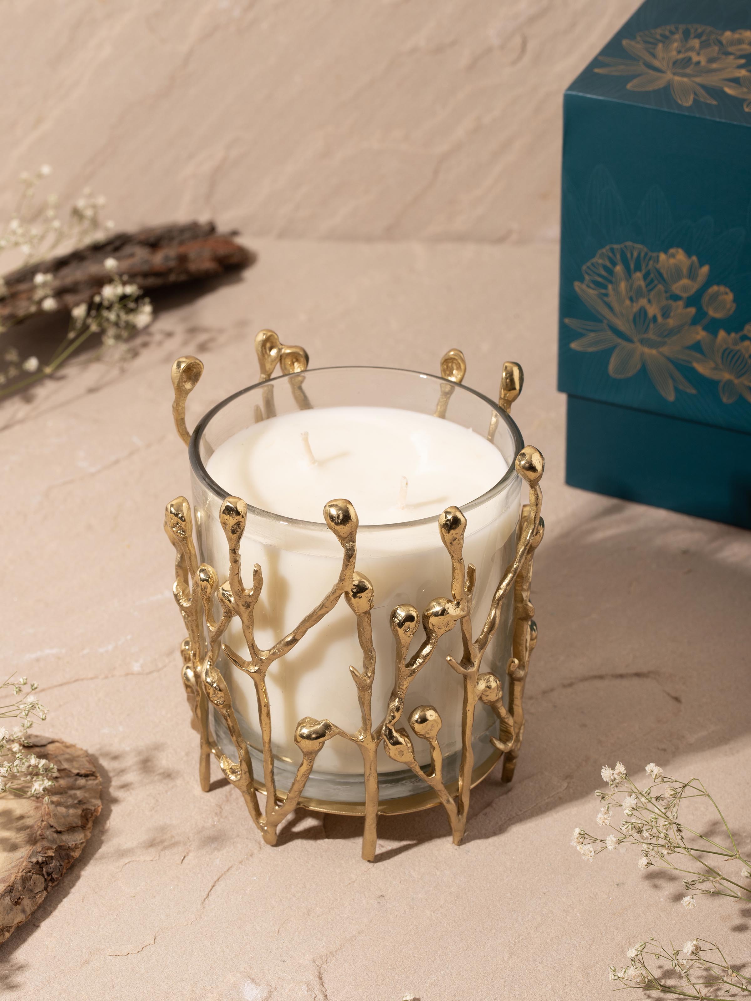 Side view of medium brass candle highlighting the intricate detailing and polished finish