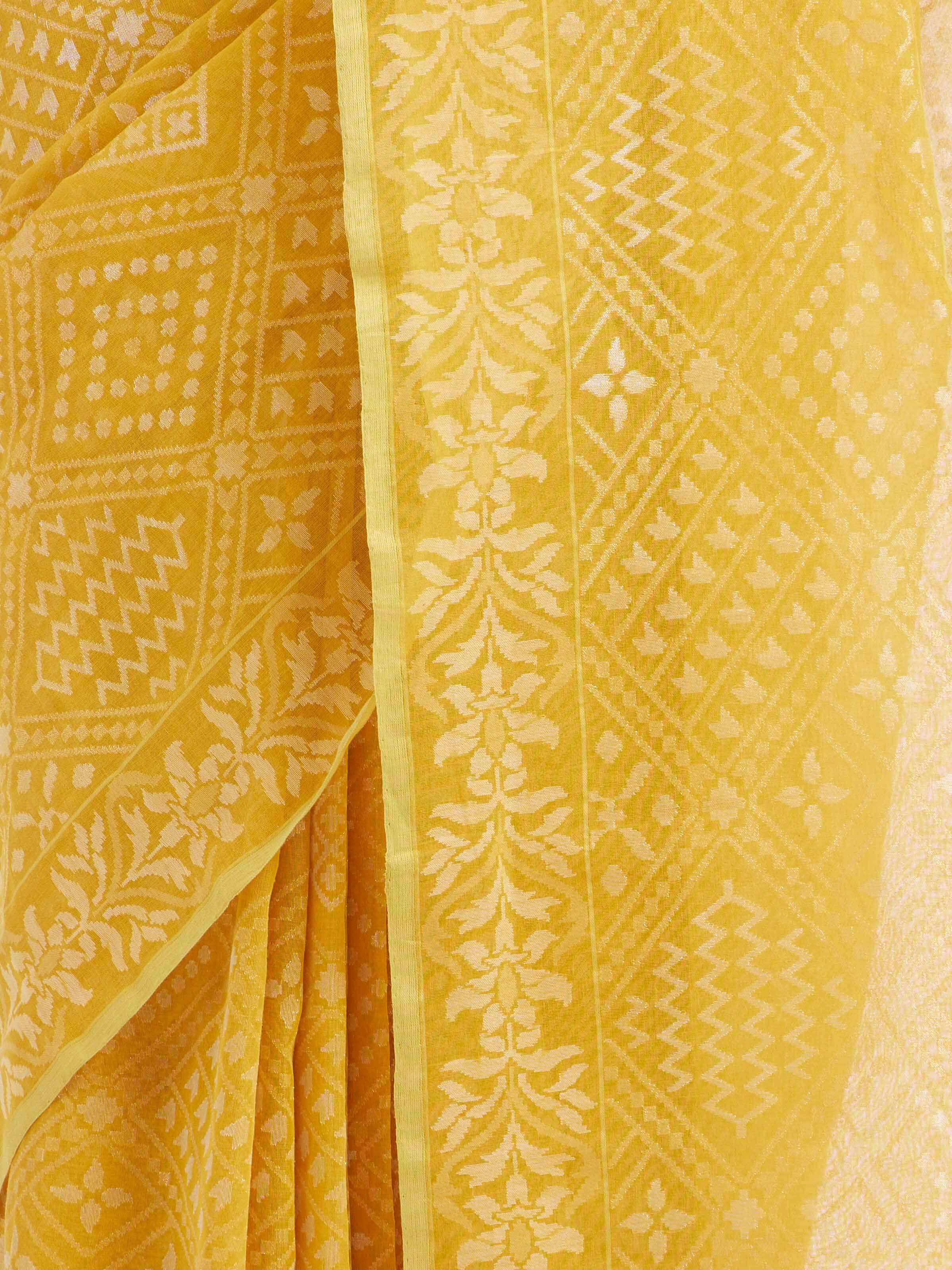 Detail view of yellow cotton Awadh Jamdani Banarasi saree showing handwoven texture