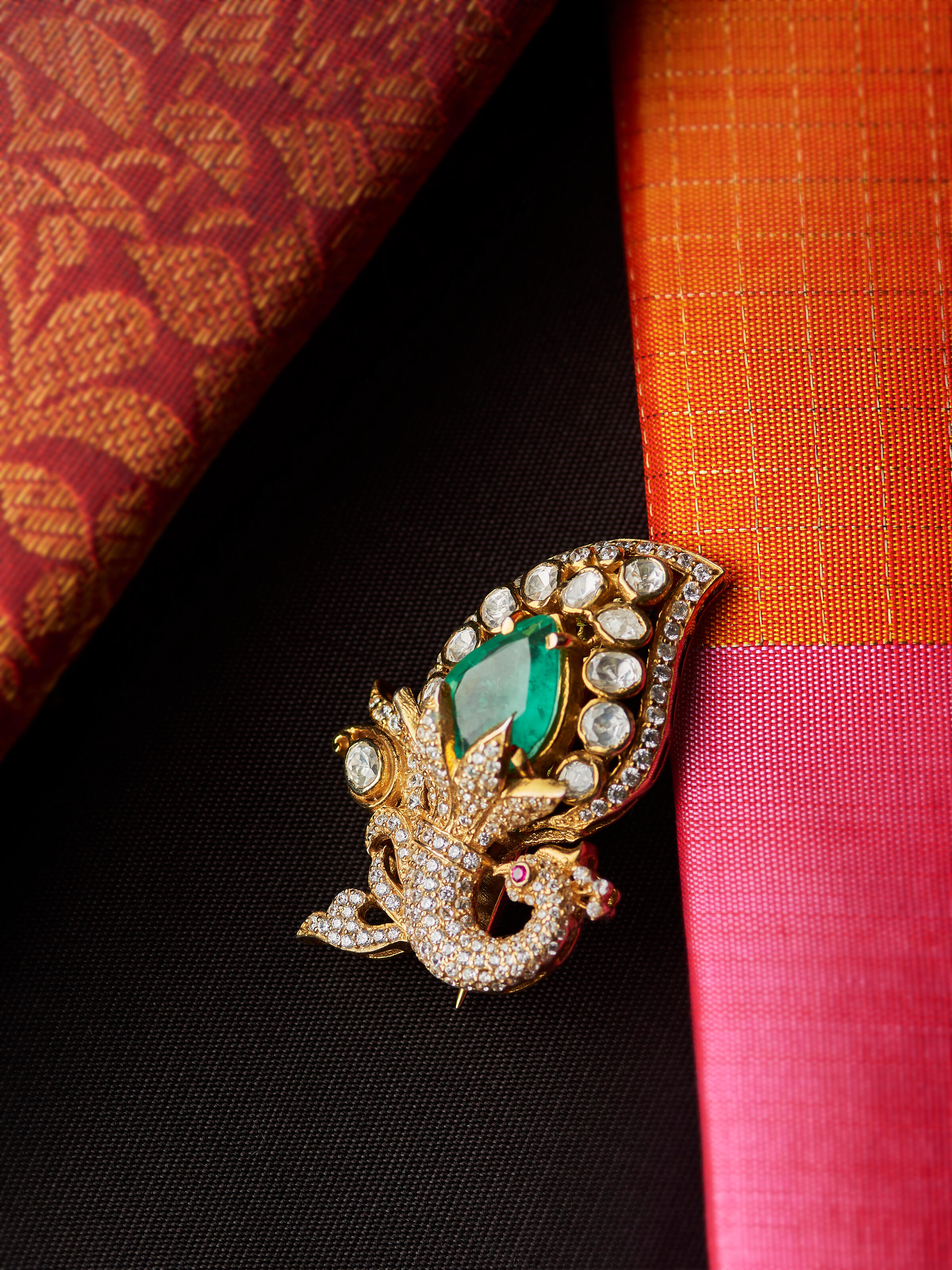 detail view of silver smithing yellow gold brooch pin pattern