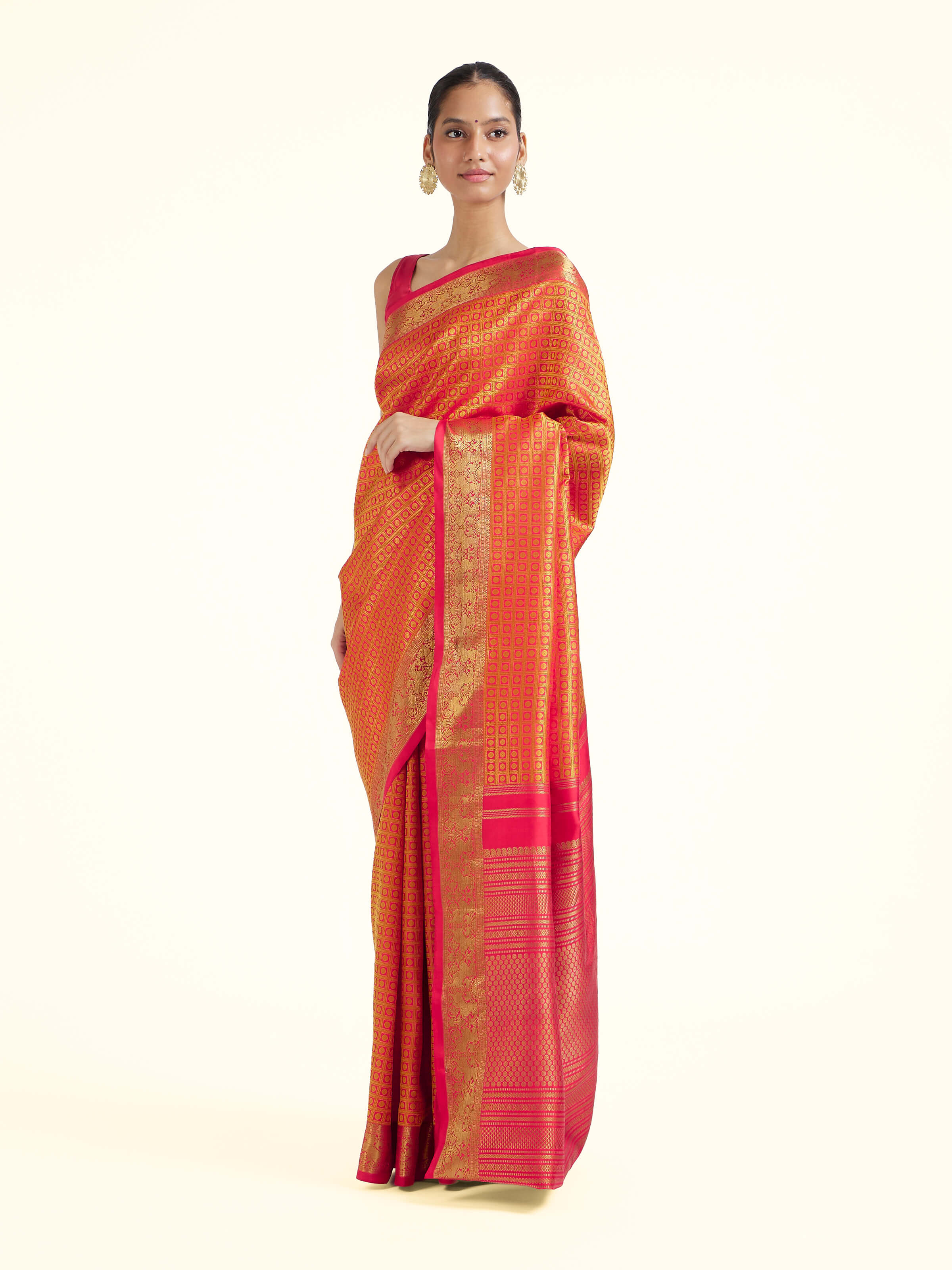 Side view of gold silk Kancheepuram saree with elegant drape and traditional border
