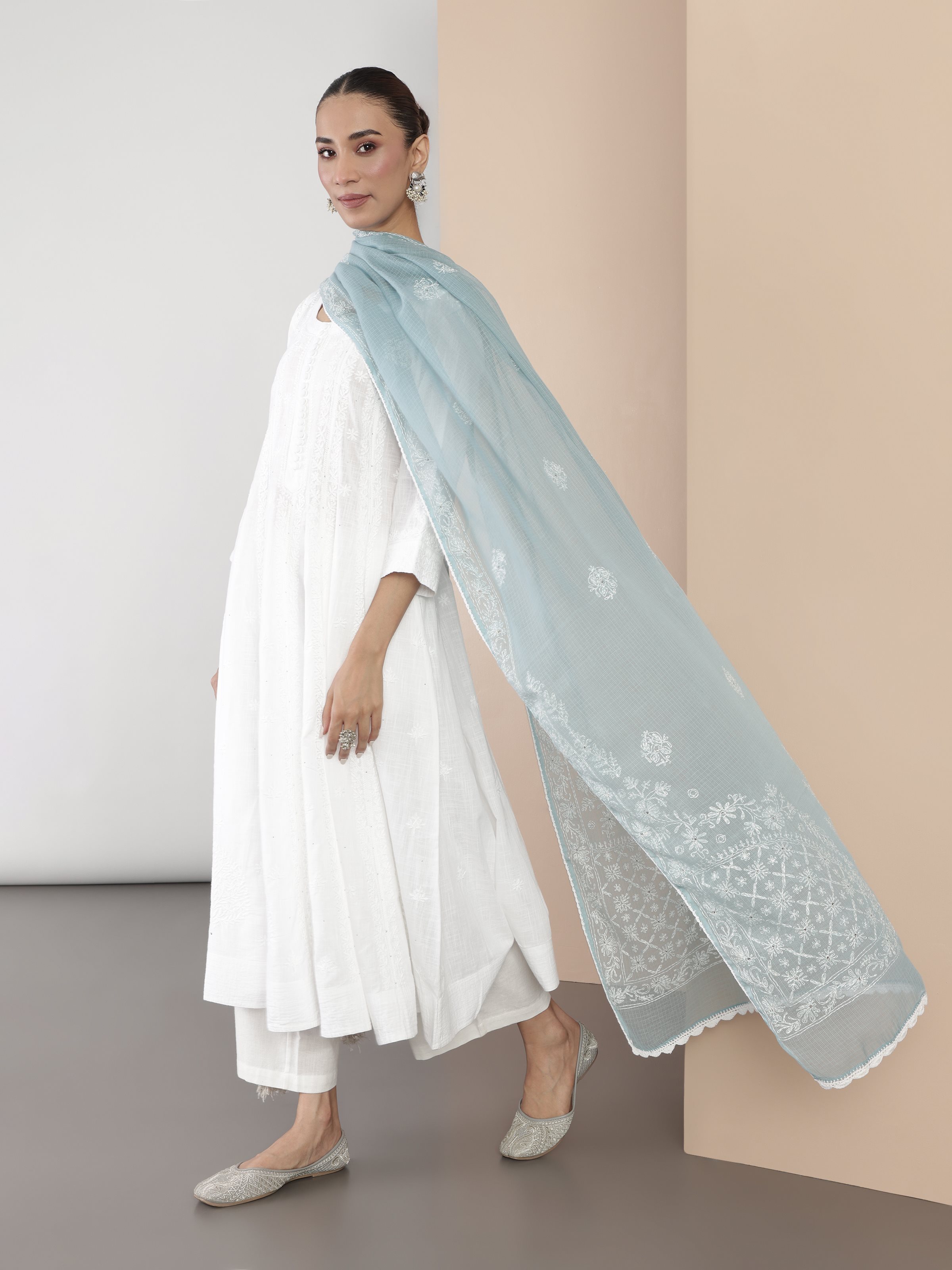 Lifestyle shot highlighting the dreamy silhouette and delicate embroidery.