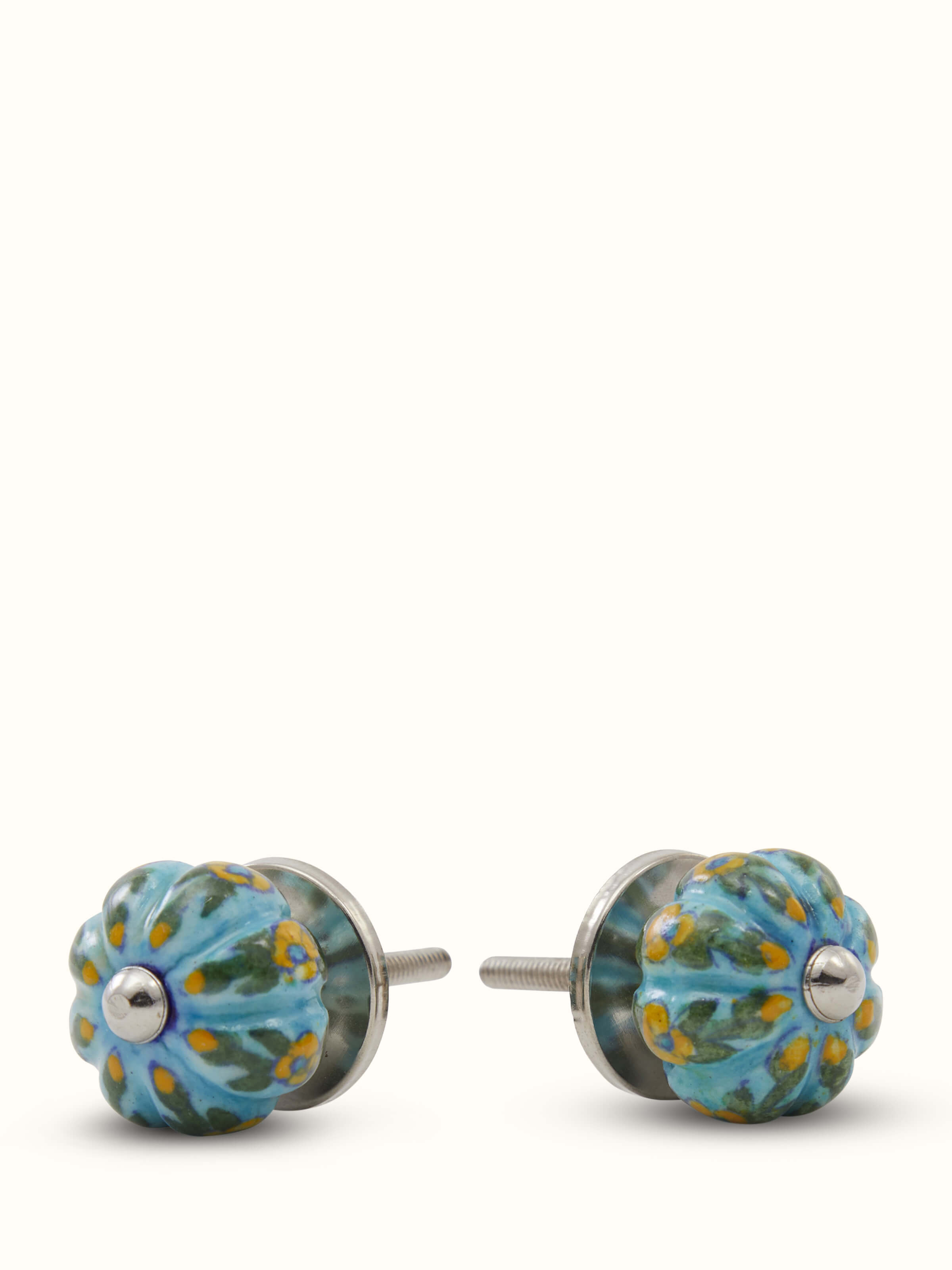 Angled view of blue pottery round rib door knob set handcrafted ceramic hardware